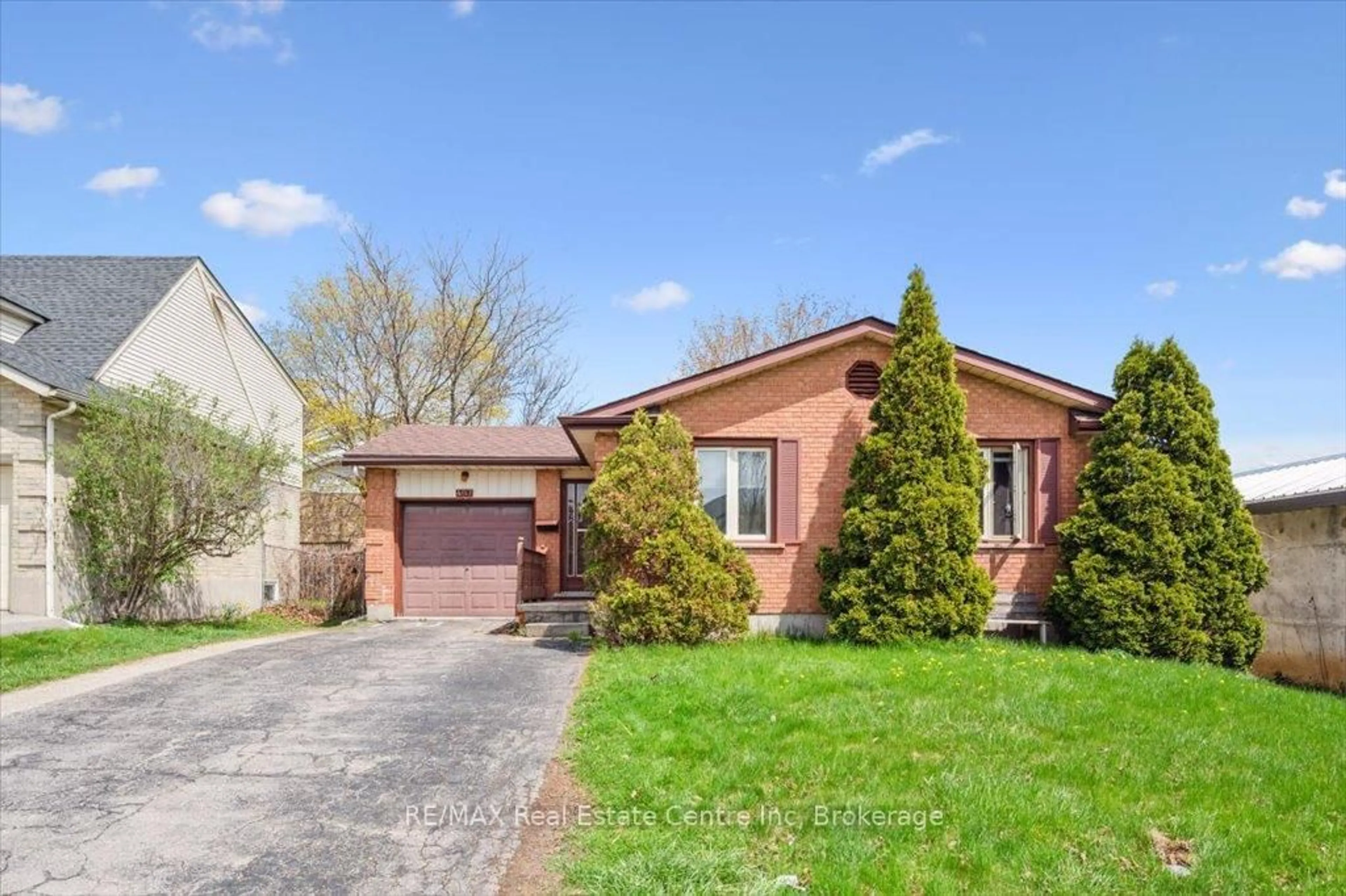 Home with brick exterior material, street for 407 IRONWOOD Rd, Guelph Ontario N1G 3R2