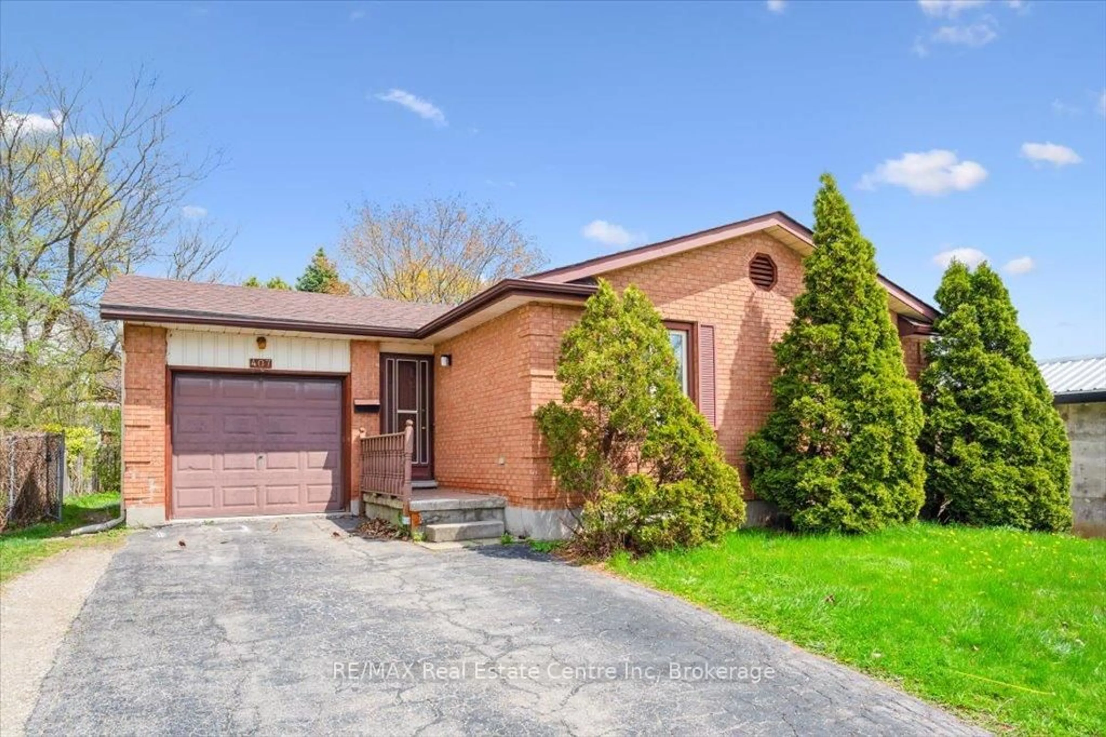 Home with brick exterior material, street for 407 IRONWOOD Rd, Guelph Ontario N1G 3R2