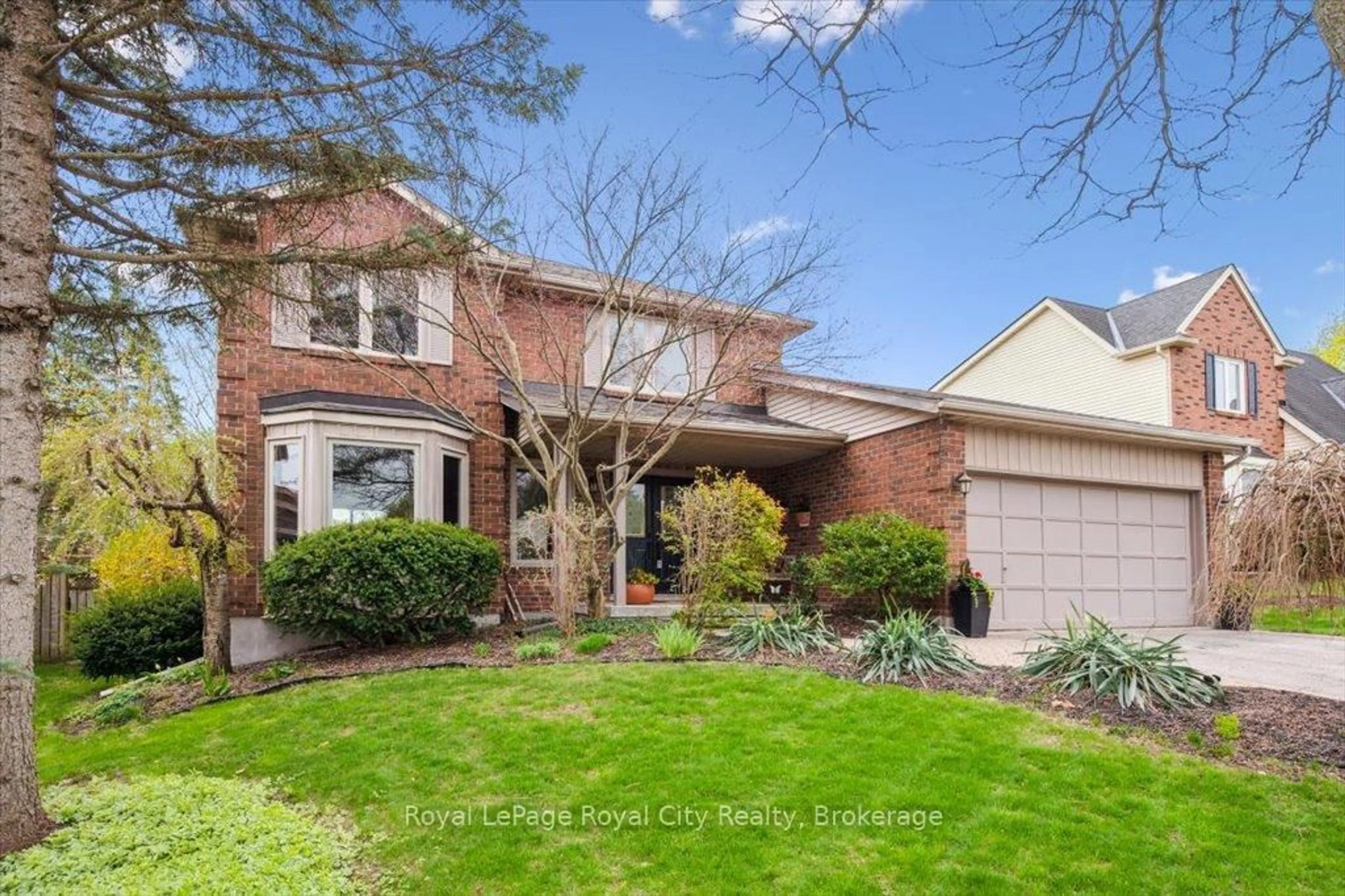Home with brick exterior material, street for 5 Hazelwood Dr, Guelph Ontario N1C 1A7