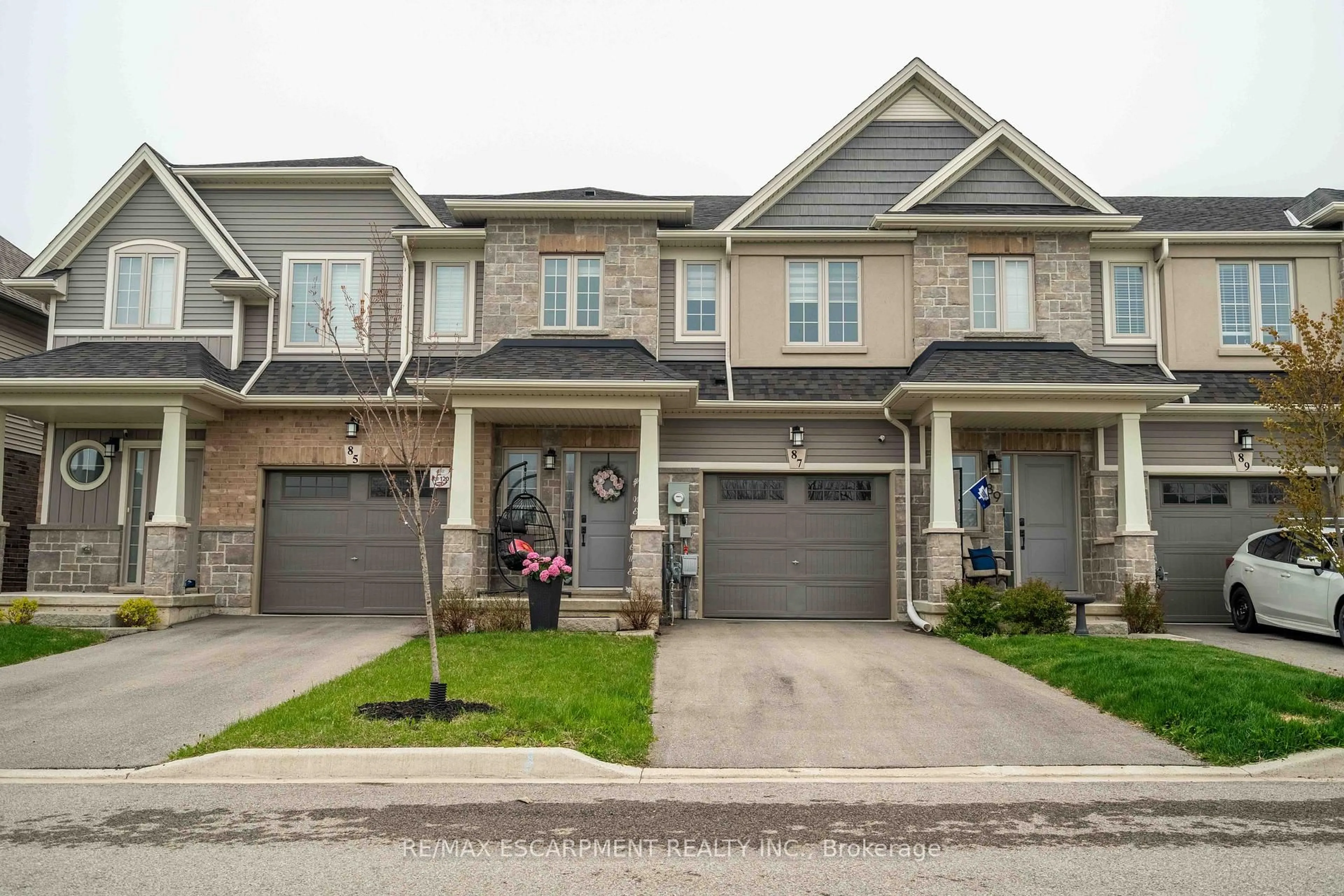 Home with brick exterior material, street for 87 Beasley Grve, Hamilton Ontario L9K 0J7