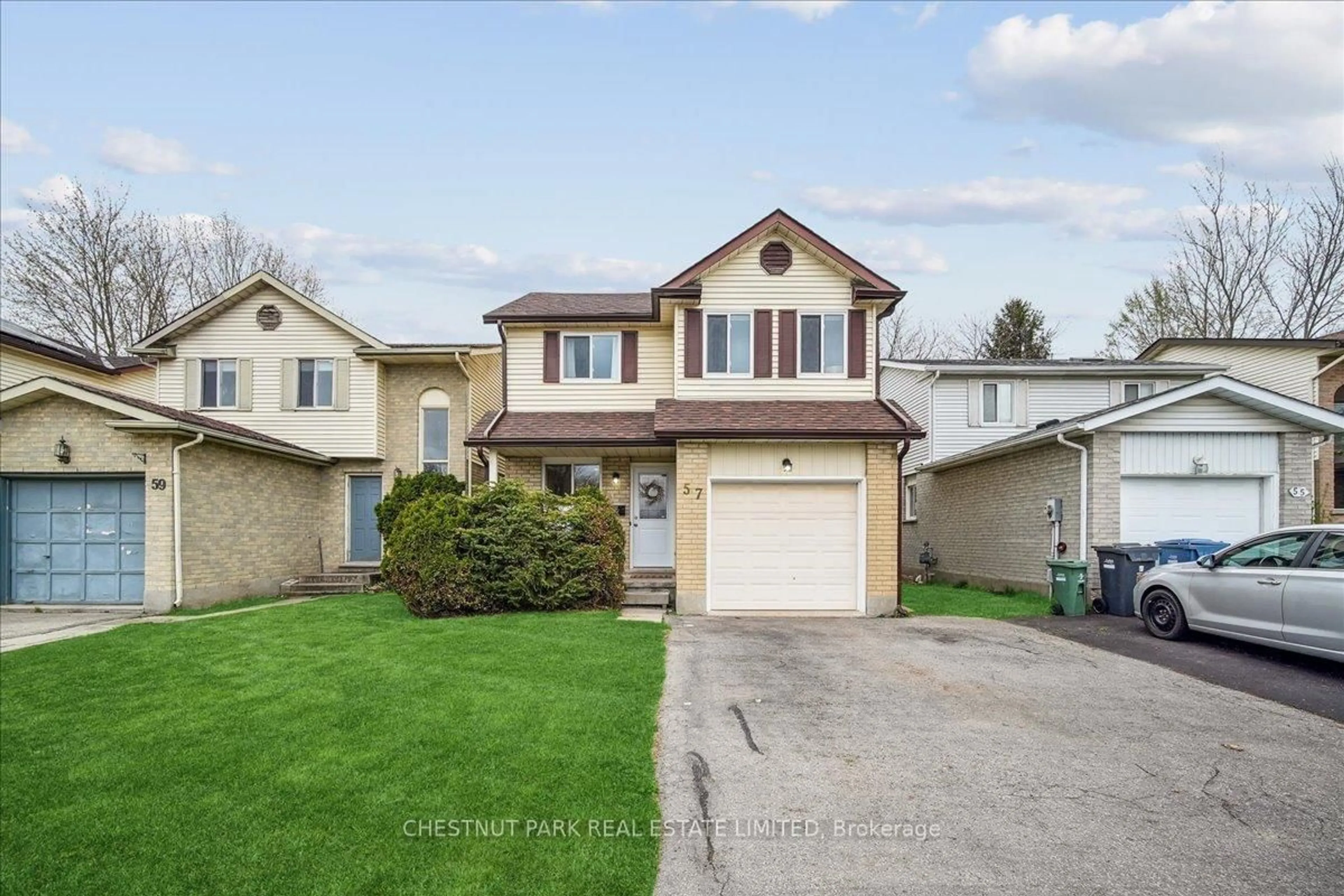 Home with vinyl exterior material, street for 57 Ironwood Rd, Guelph Ontario N1G 4E9
