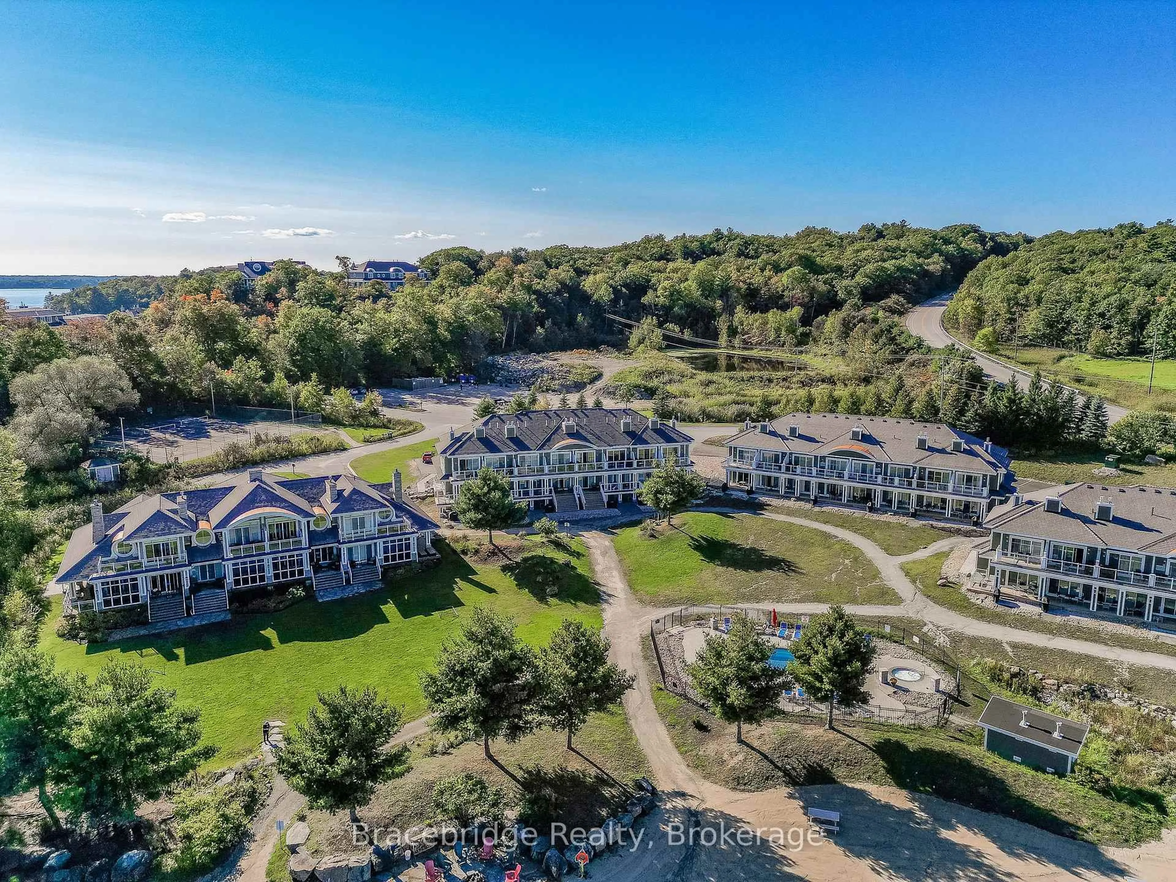 A pic from outside/outdoor area/front of a property/back of a property/a pic from drone, water/lake/river/ocean view for 1869 MUSKOKA ROAD 118 Highway #G104-D2, Muskoka Lakes Ontario P1L 1W8