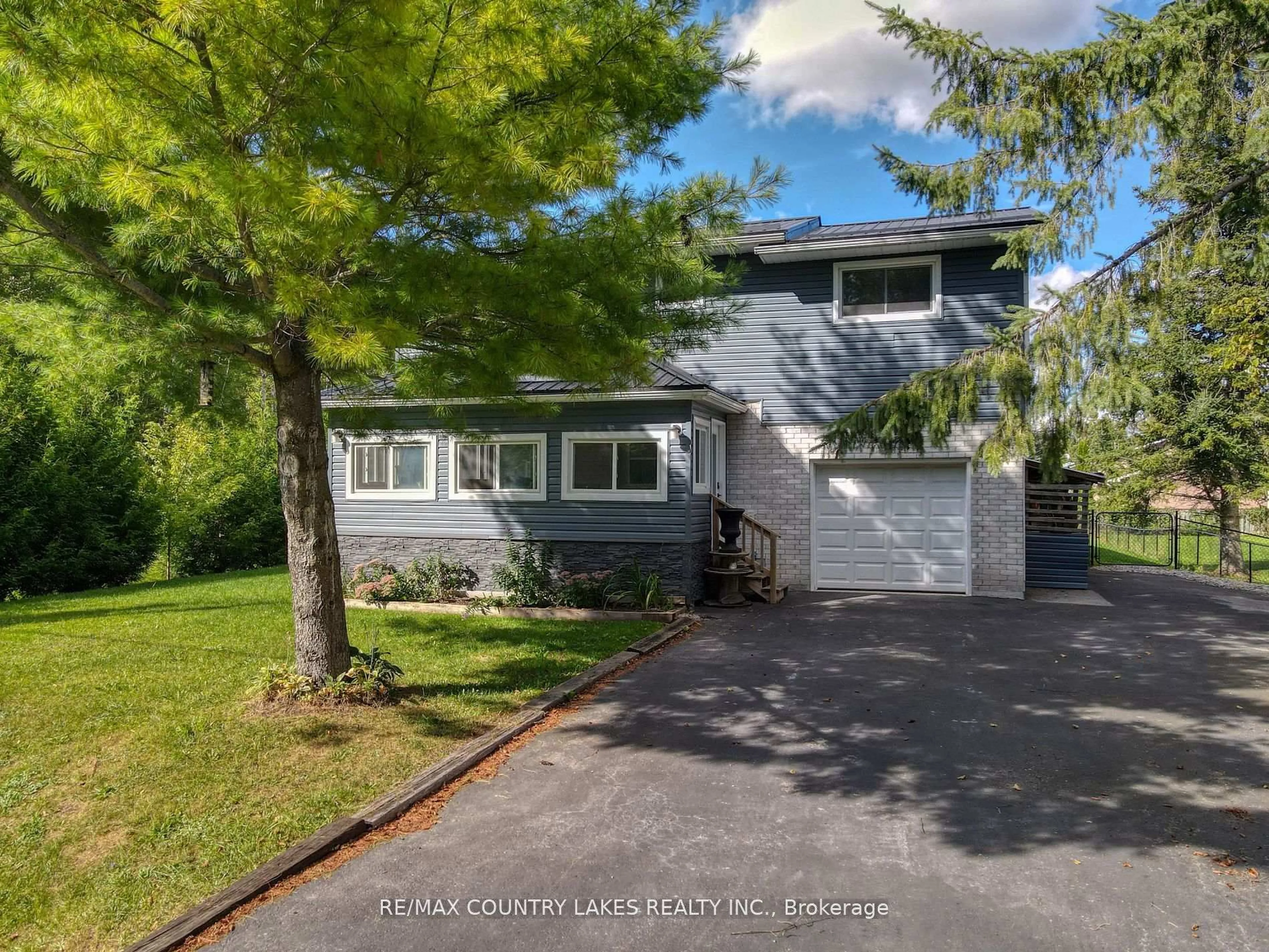 A pic from outside/outdoor area/front of a property/back of a property/a pic from drone, street for 3 Pinewood Blvd, Kawartha Lakes Ontario K0M 2T0