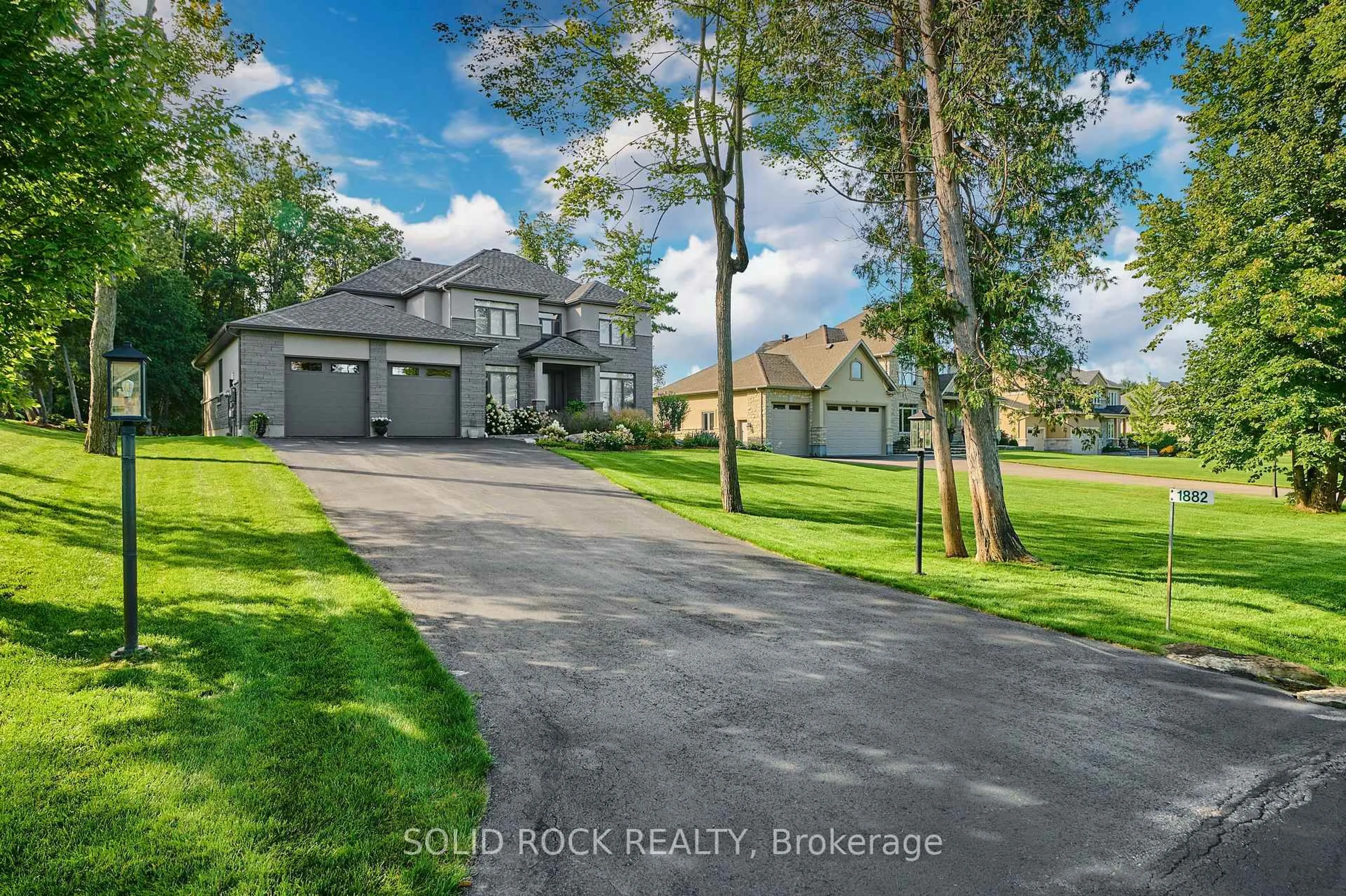 A pic from outside/outdoor area/front of a property/back of a property/a pic from drone, water/lake/river/ocean view for 1882 Cedarlakes Way, Ottawa Ontario K4P 0E4