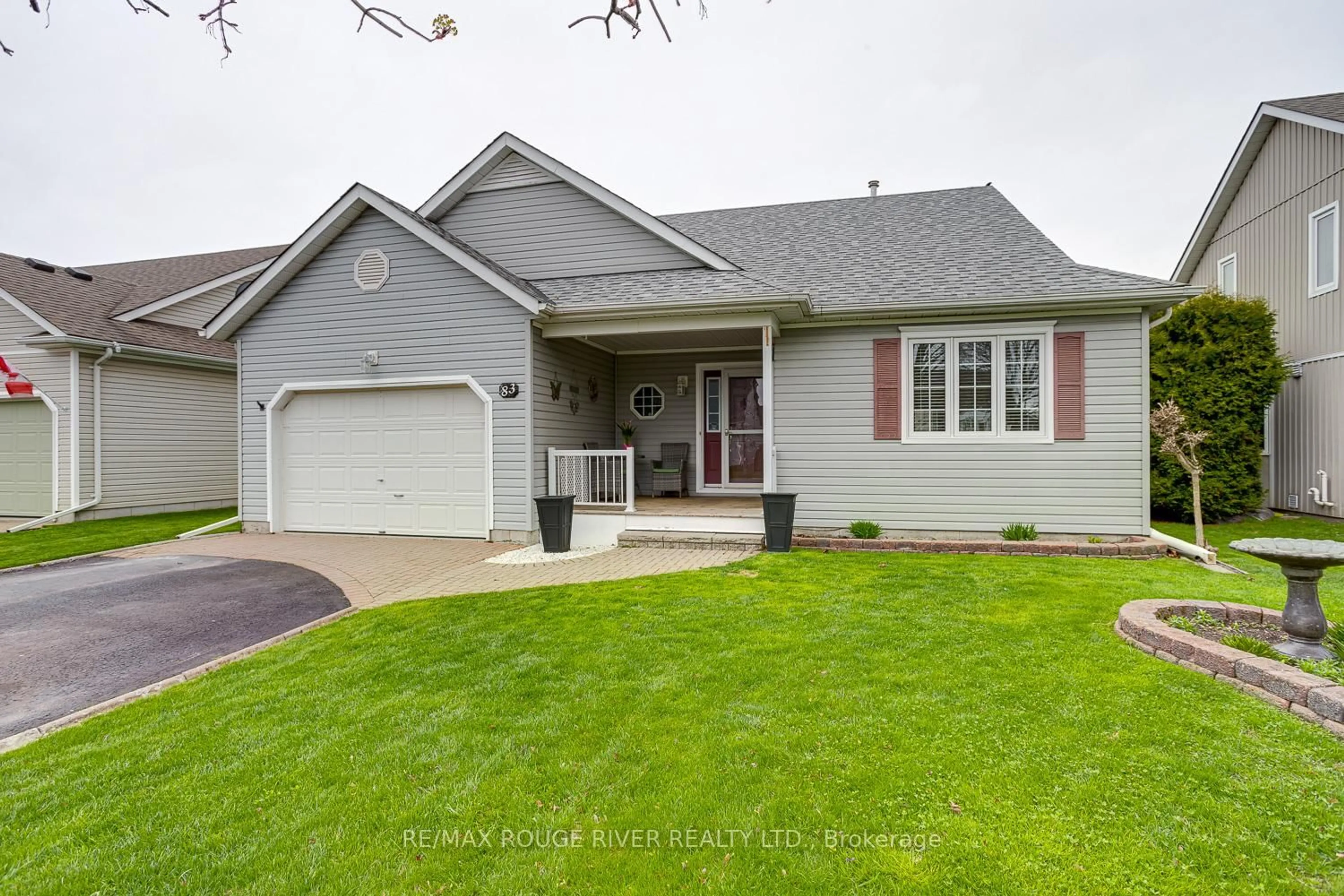 Home with vinyl exterior material, street for 83 Mills Rd, Brighton Ontario K0K 1H0