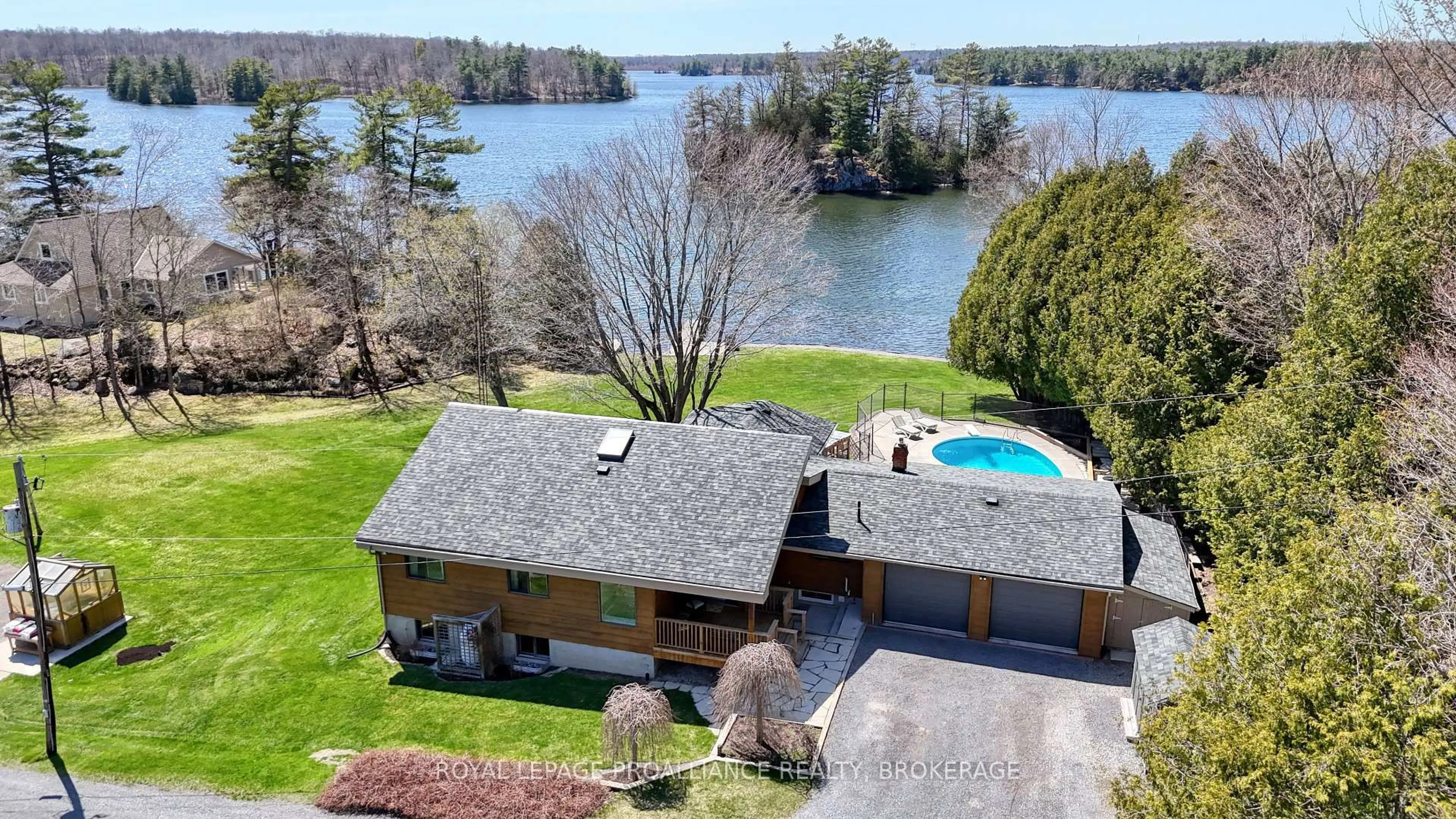 A pic from outside/outdoor area/front of a property/back of a property/a pic from drone, water/lake/river/ocean view for 4647 Jones Lane, Battersea Ontario K0H 1H0