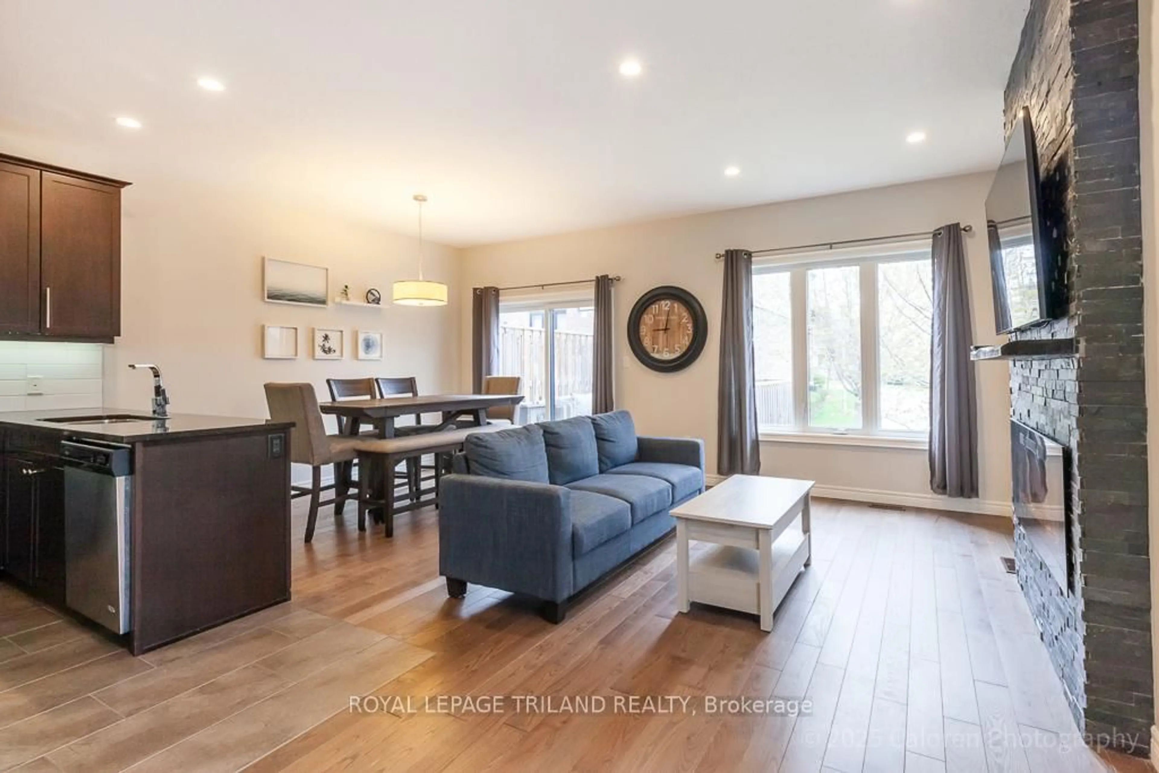 Living room with furniture, wood/laminate floor for 2235 Blackwater Rd #2, London North Ontario N5X 0L8