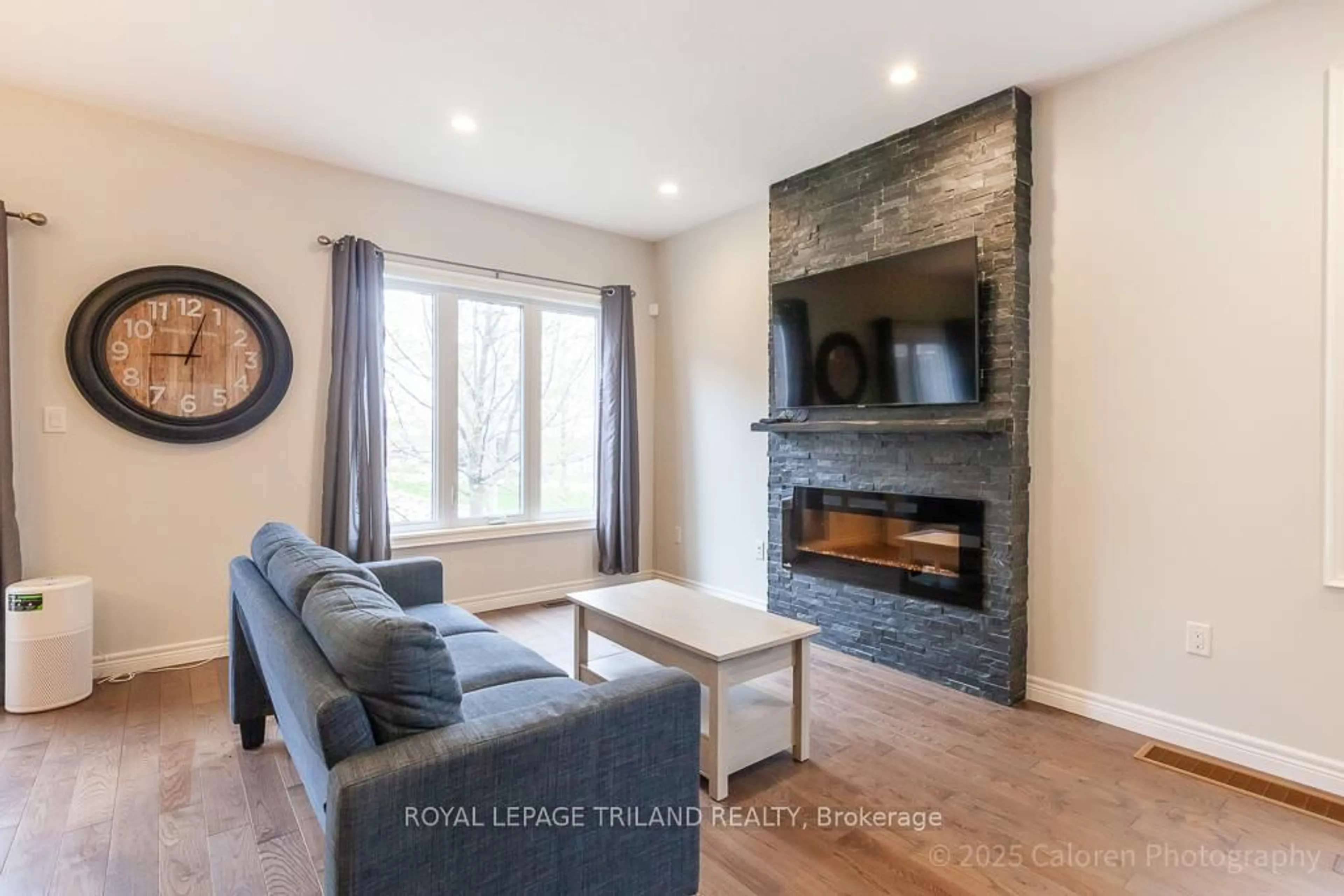 Living room with furniture, wood/laminate floor for 2235 Blackwater Rd #2, London North Ontario N5X 0L8