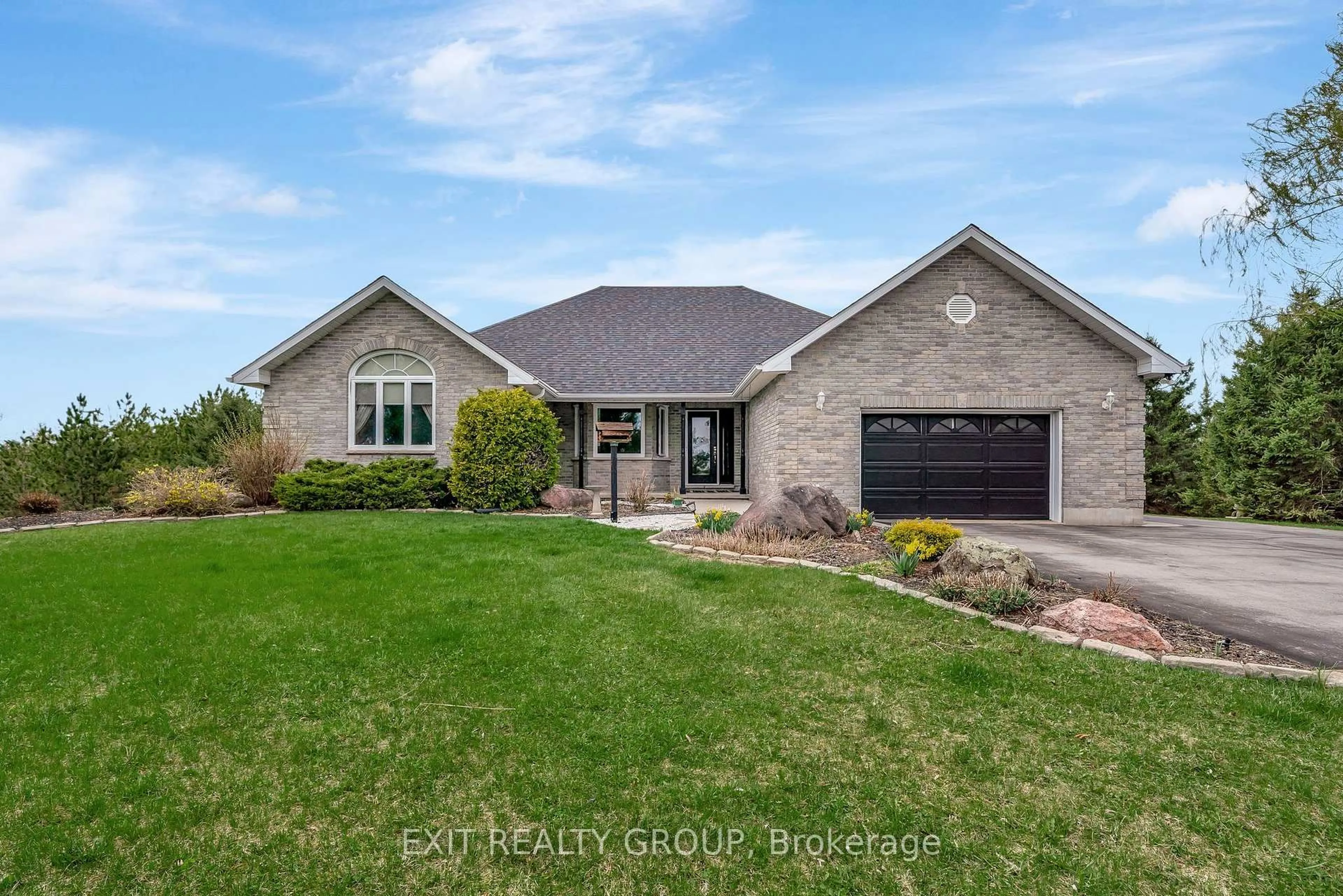 Home with brick exterior material, street for 39 Woods Rd, Madoc Ontario K0K 2K0