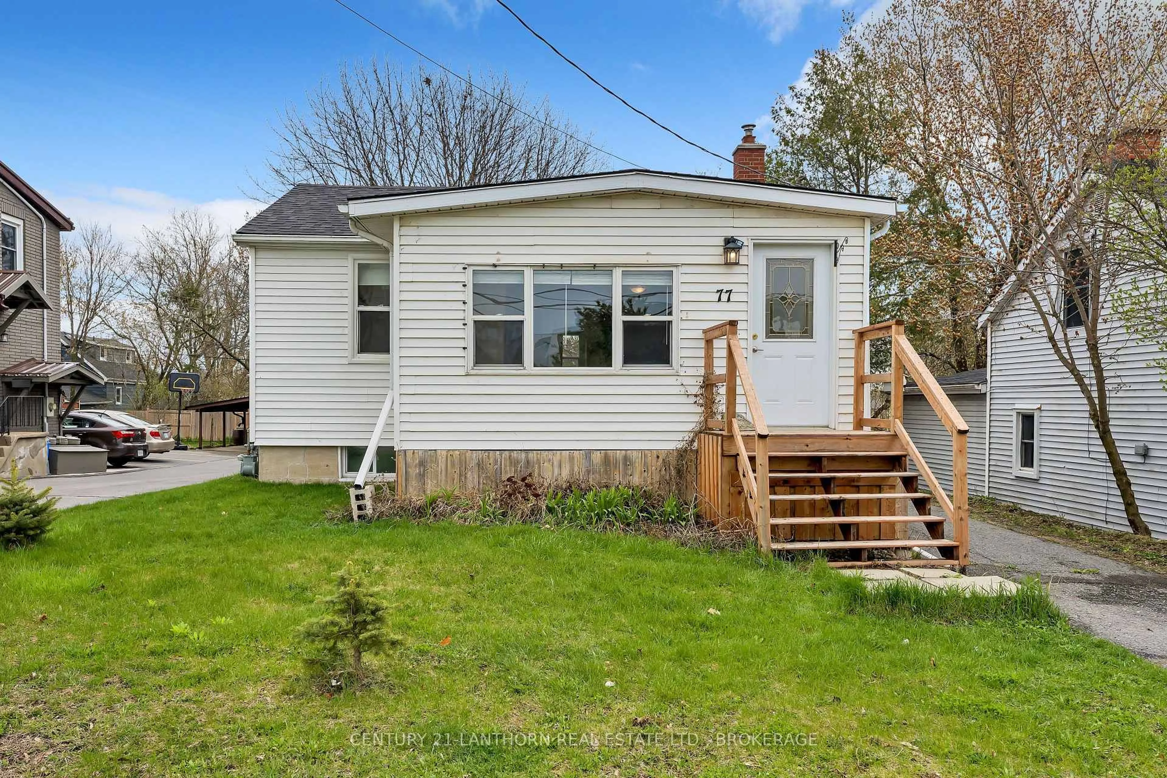 Home with vinyl exterior material, street for 77 Portsmouth Ave, Kingston Ontario K7M 1V4