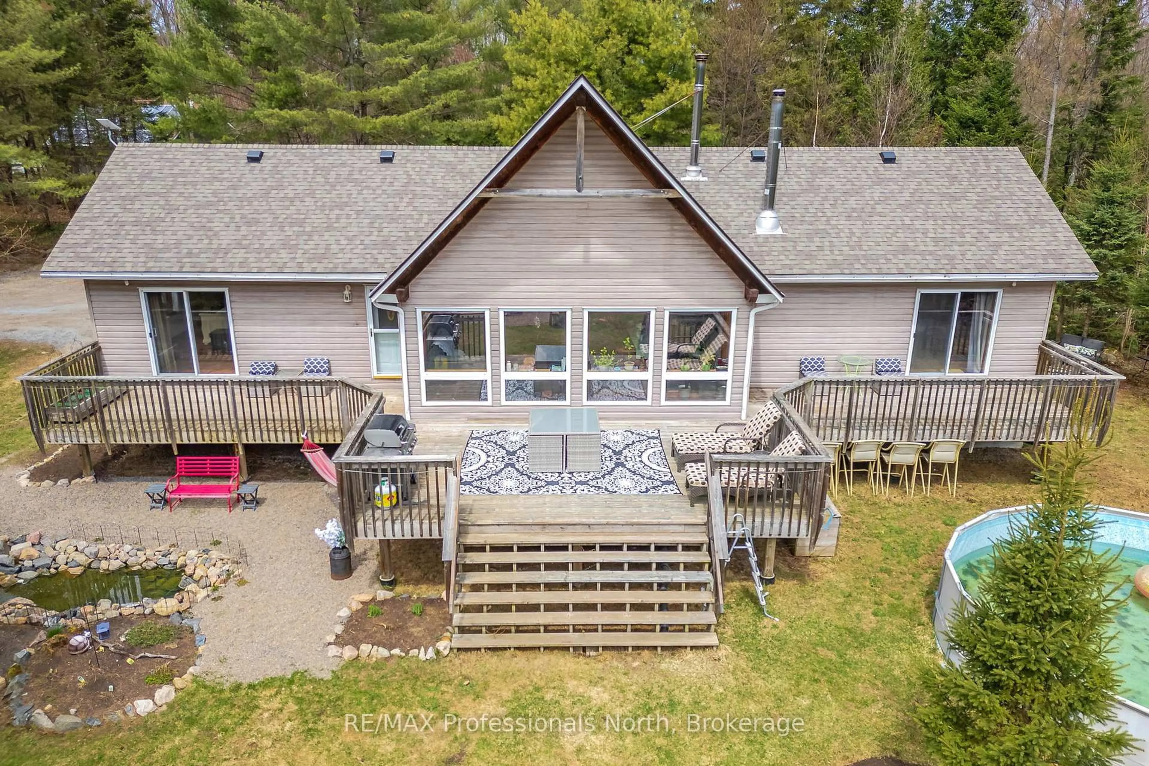 A pic from outside/outdoor area/front of a property/back of a property/a pic from drone, water/lake/river/ocean view for 649 YEARLEY Rd, Huntsville Ontario P0B 1M0
