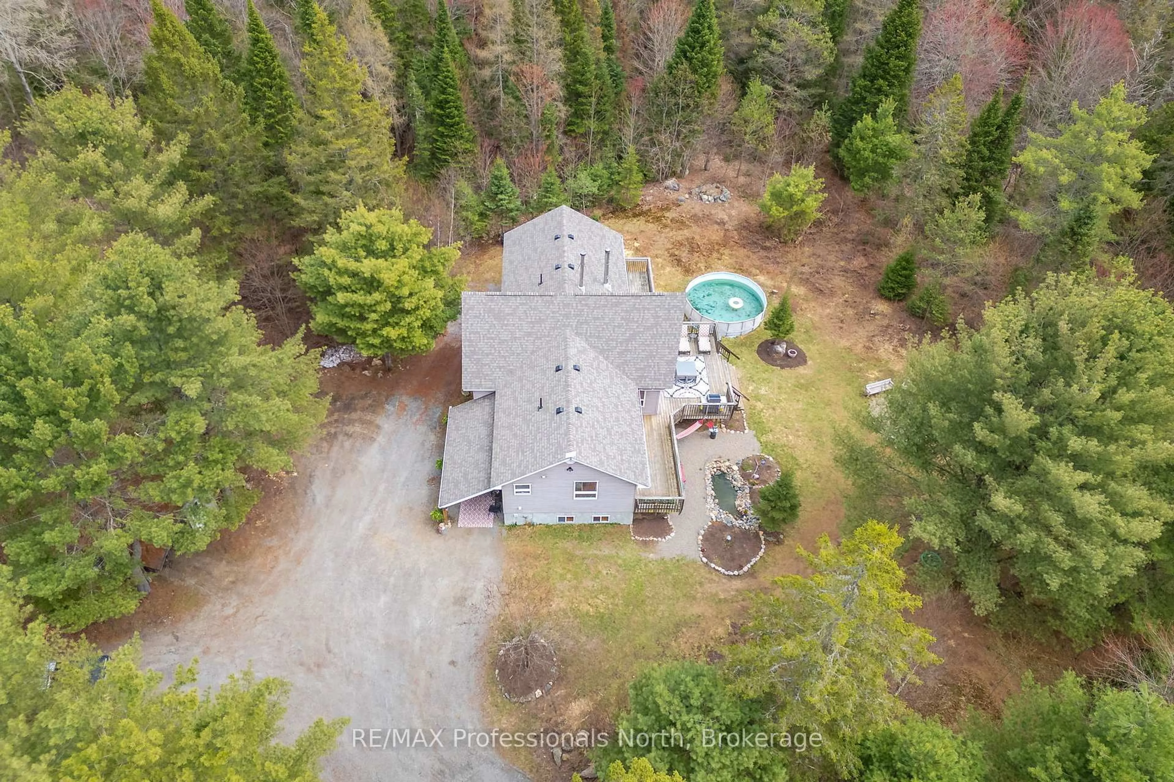 A pic from outside/outdoor area/front of a property/back of a property/a pic from drone, forest/trees view for 649 YEARLEY Rd, Huntsville Ontario P0B 1M0