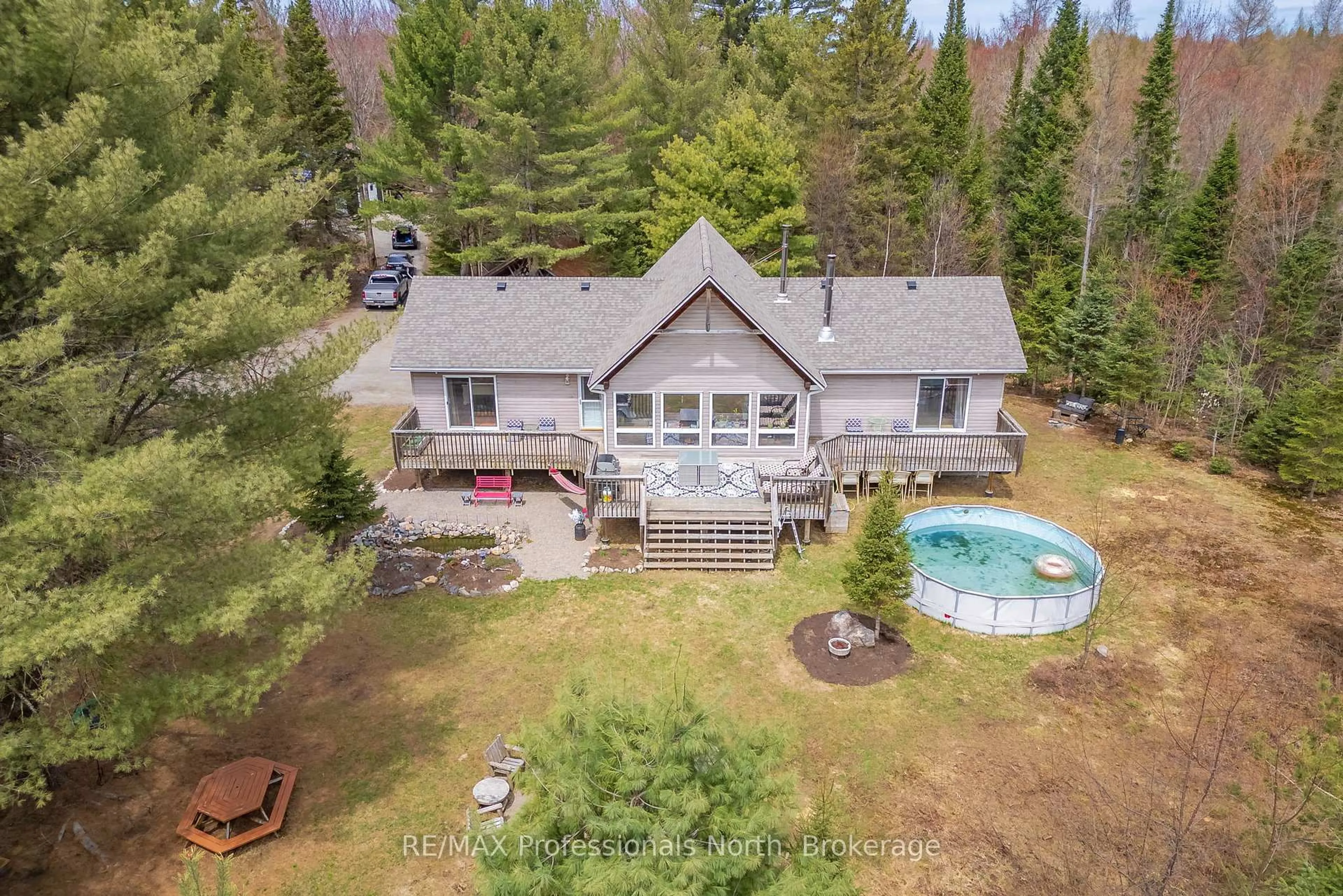 A pic from outside/outdoor area/front of a property/back of a property/a pic from drone, water/lake/river/ocean view for 649 YEARLEY Rd, Huntsville Ontario P0B 1M0