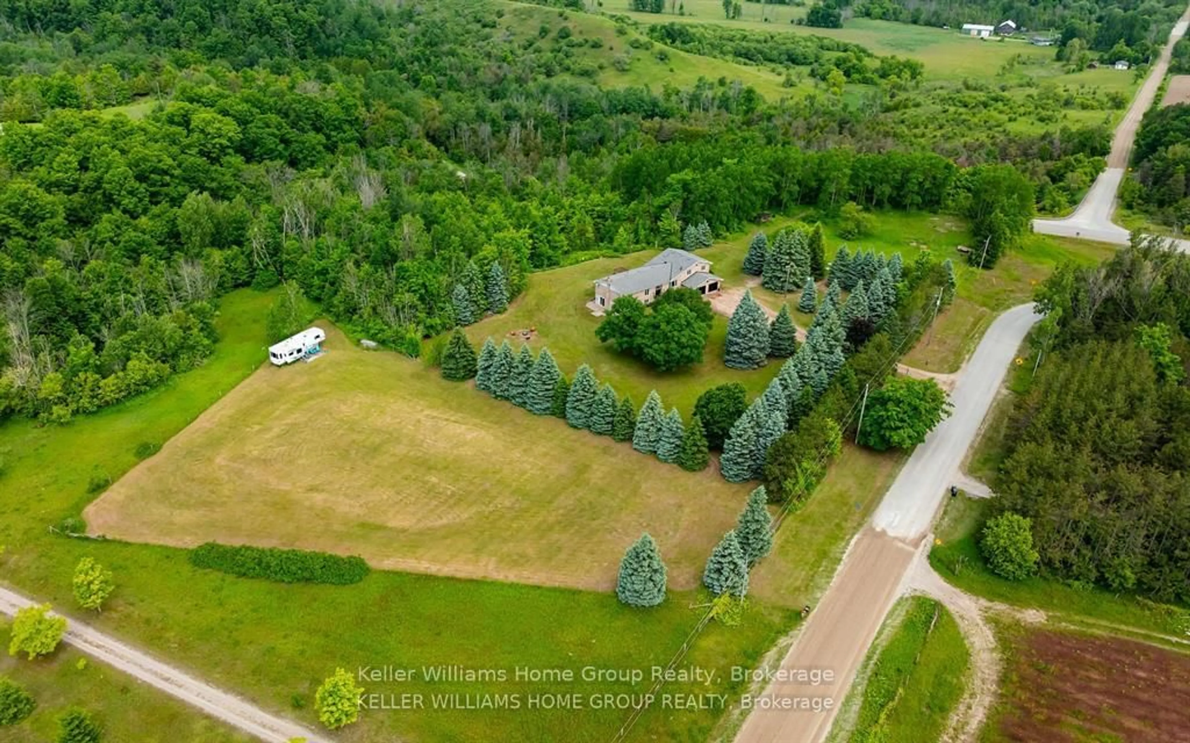 A pic from outside/outdoor area/front of a property/back of a property/a pic from drone, unknown for 996594 Mulmur Tos Townline N/A, Mulmur Ontario L9V 0N2