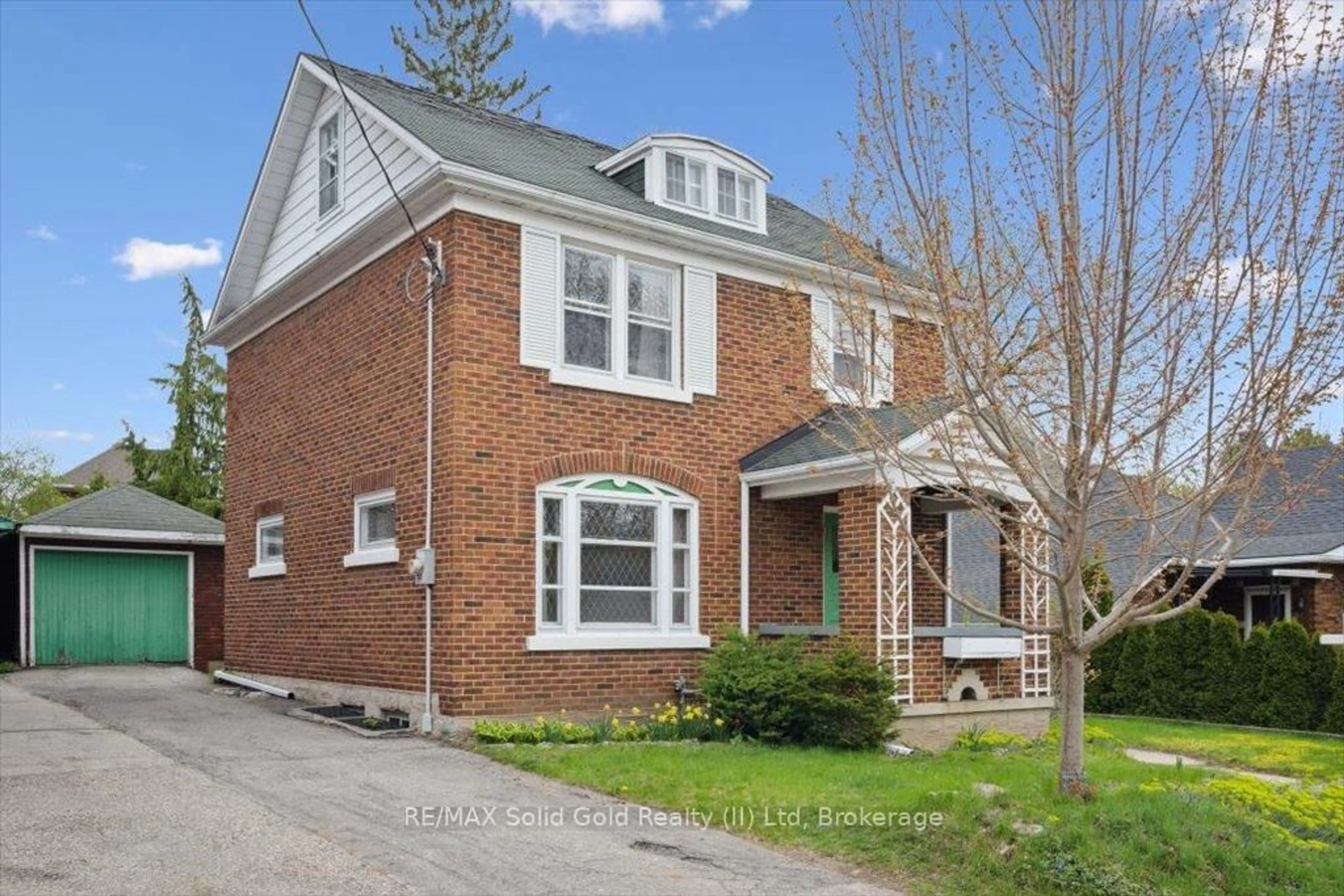 Home with brick exterior material, street for 14 Henry St, Kitchener Ontario N2G 1P3