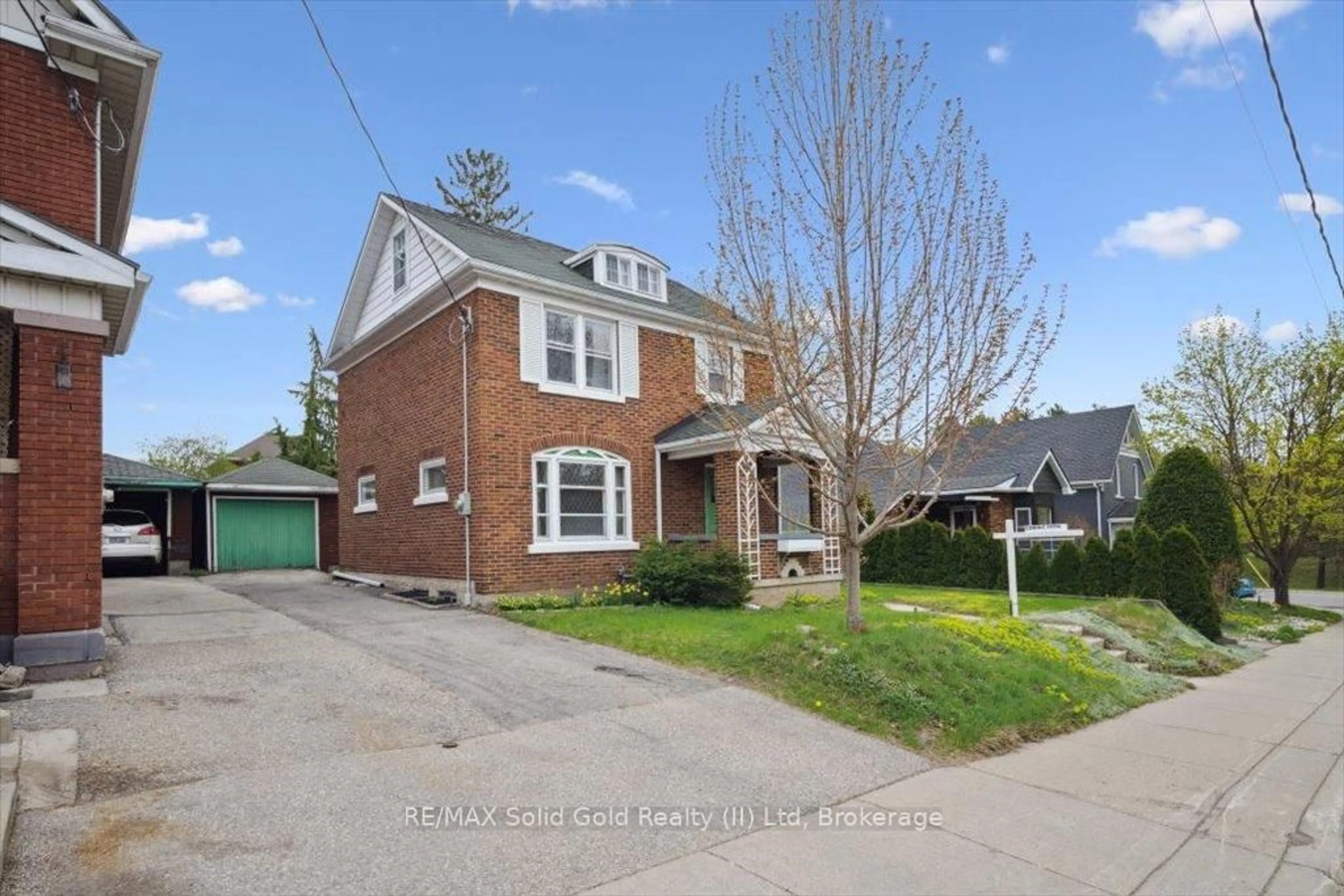 Home with brick exterior material, street for 14 Henry St, Kitchener Ontario N2G 1P3