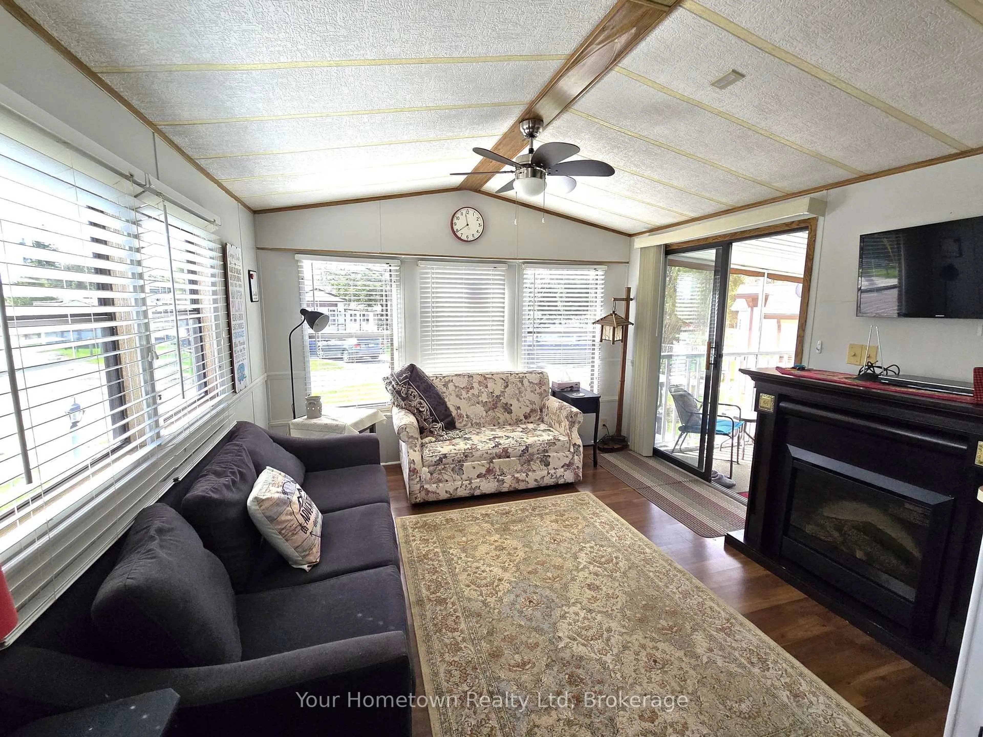 Living room with furniture, wood/laminate floor for 157 Cedar Cres, Centre Wellington Ontario N1M 2W5