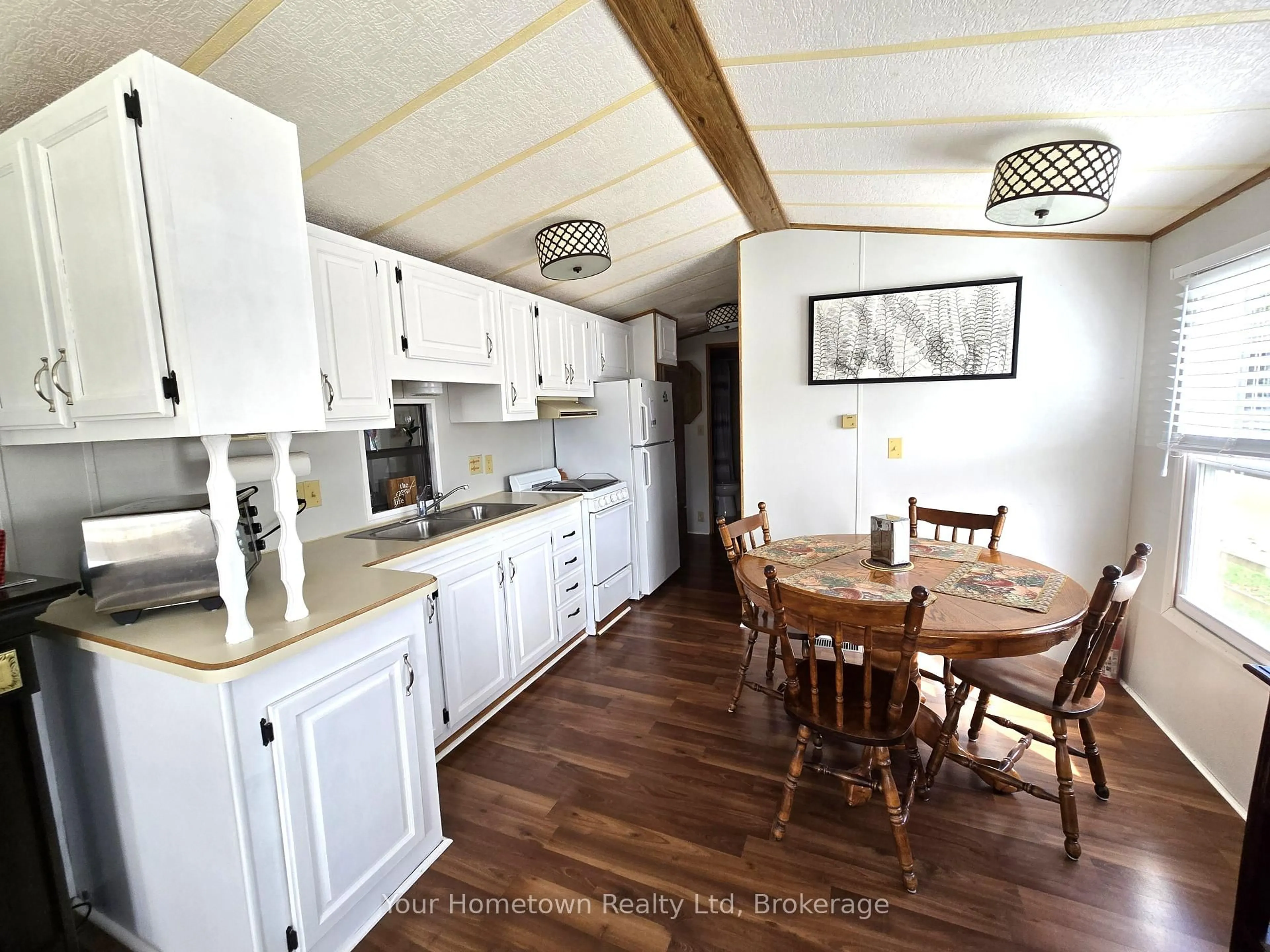Open concept kitchen, wood/laminate floor for 157 Cedar Cres, Centre Wellington Ontario N1M 2W5