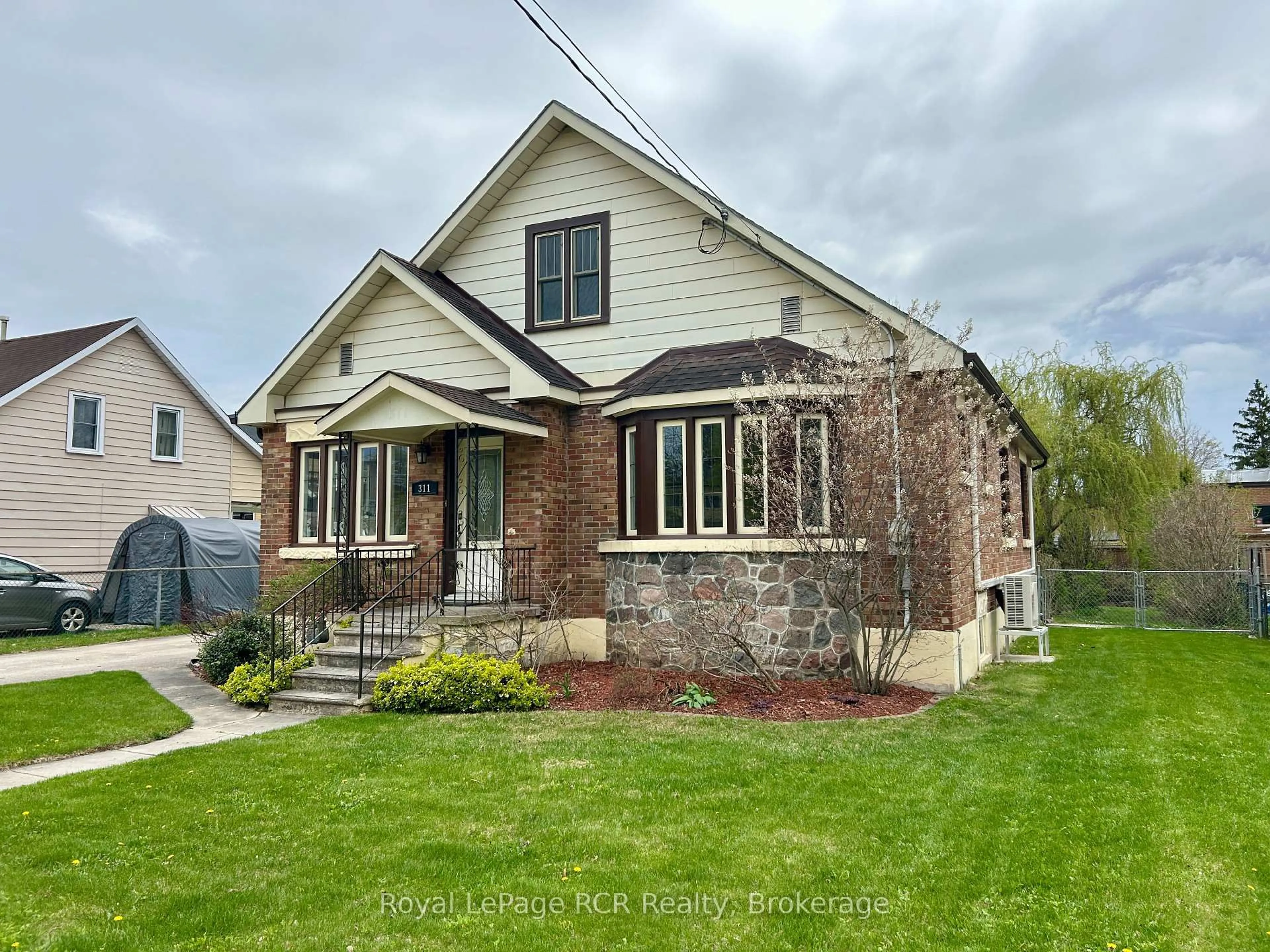 Home with brick exterior material, street for 311 12th St, Hanover Ontario N4N 1V5