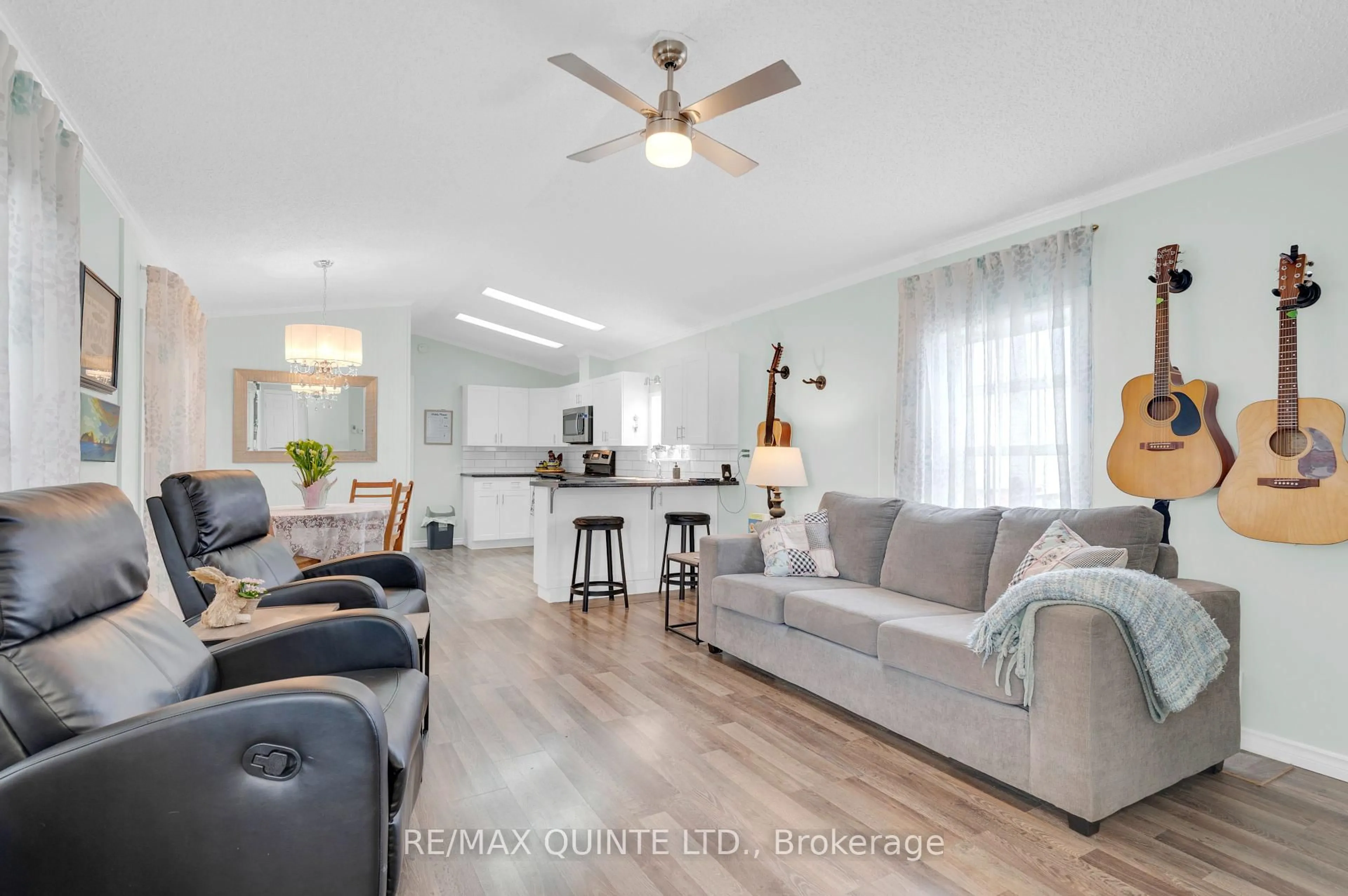 Living room with furniture, wood/laminate floor for 311 Dundas St #18, Quinte West Ontario K8V 1M1