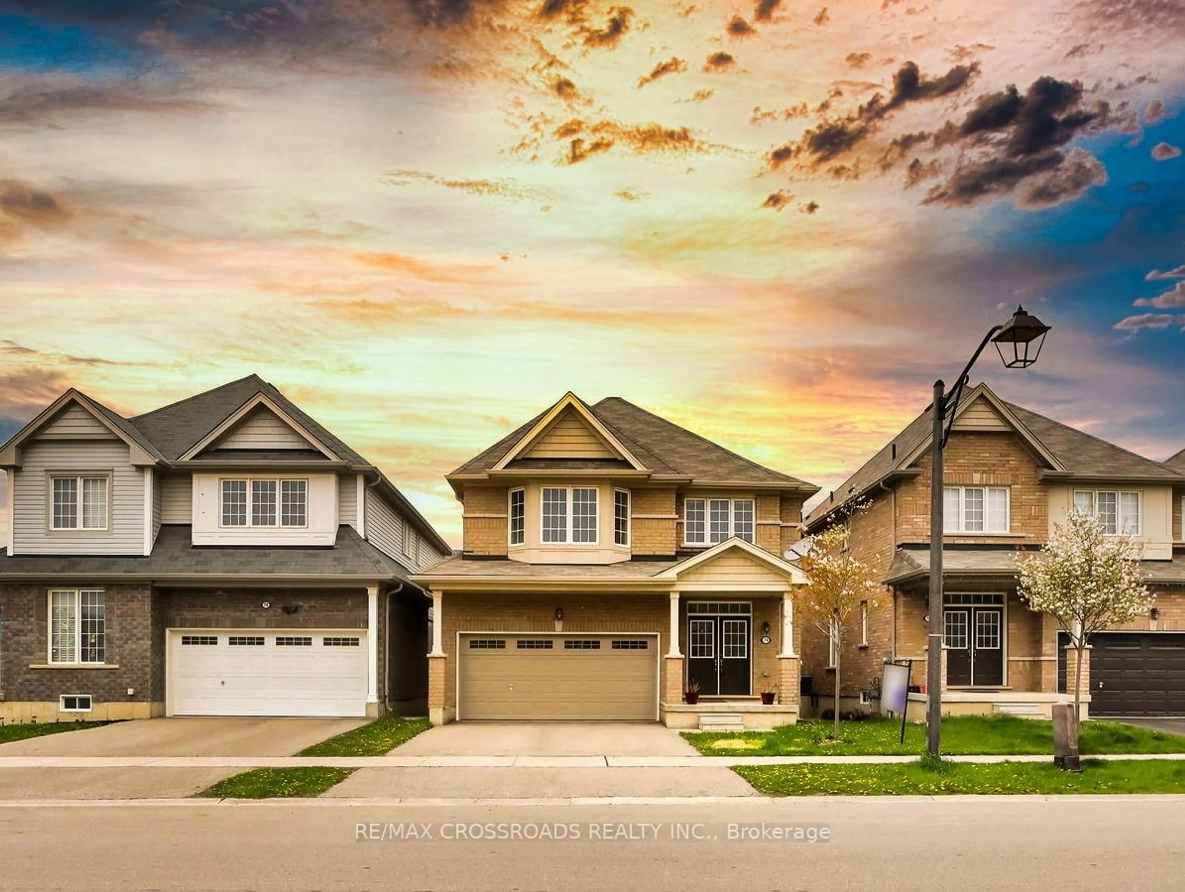 Home with vinyl exterior material, street for 74 longboat Run W Rd, Brantford Ontario N3T 5N5