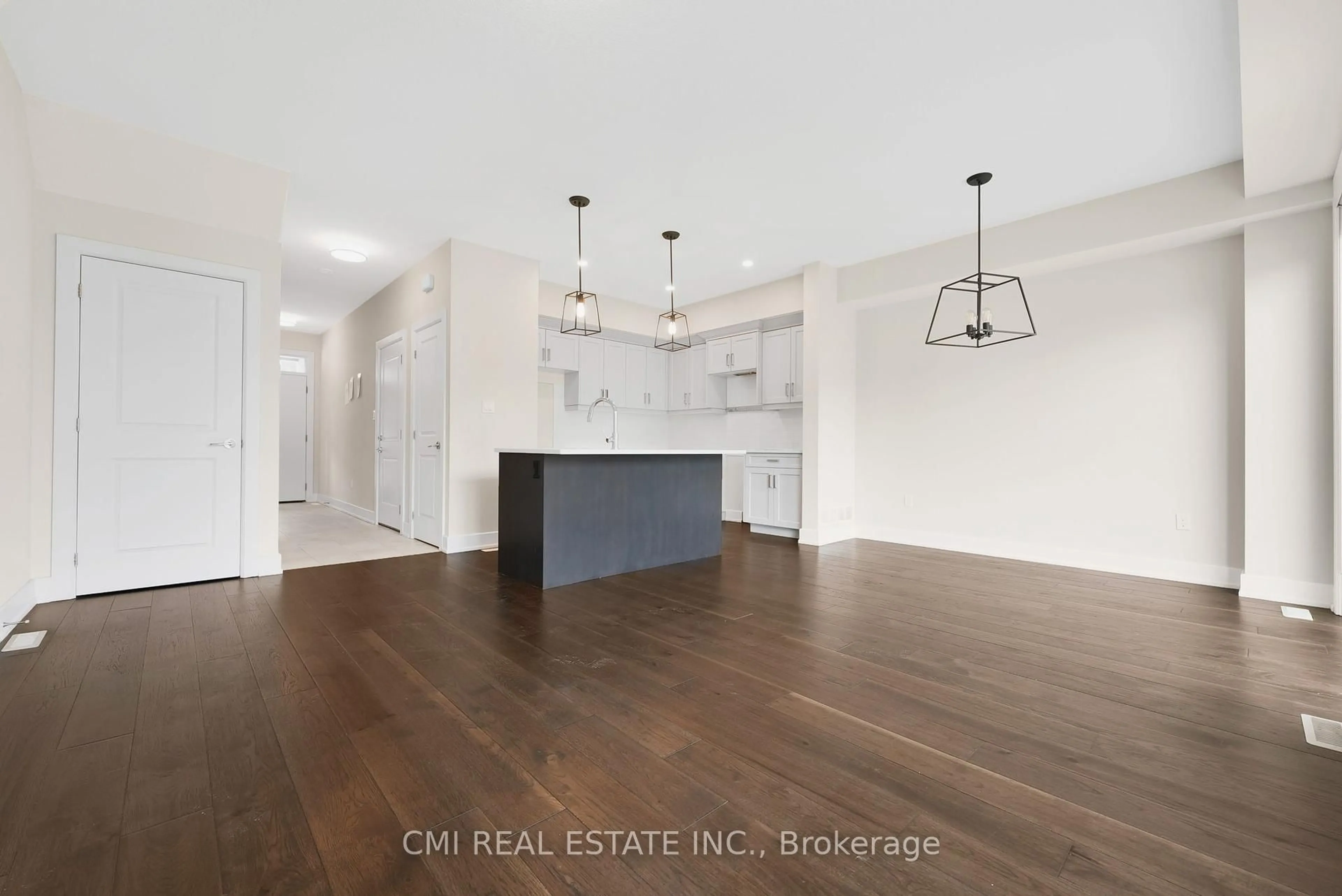 Open concept kitchen, wood/laminate floor for 601 Lions Park Dr #57, Strathroy-Caradoc Ontario N0L 1W0