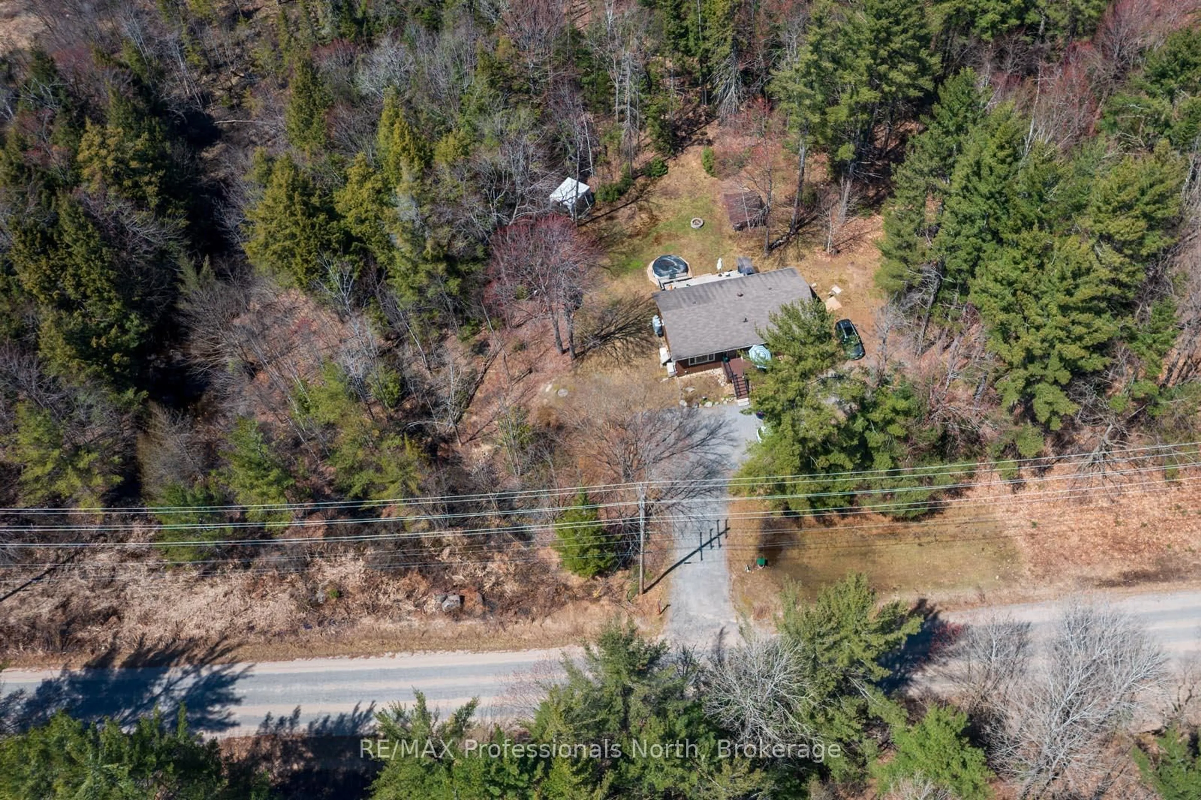 A pic from outside/outdoor area/front of a property/back of a property/a pic from drone, forest/trees view for 224 Stephenson 4 Rd, Huntsville Ontario P0B 1M0