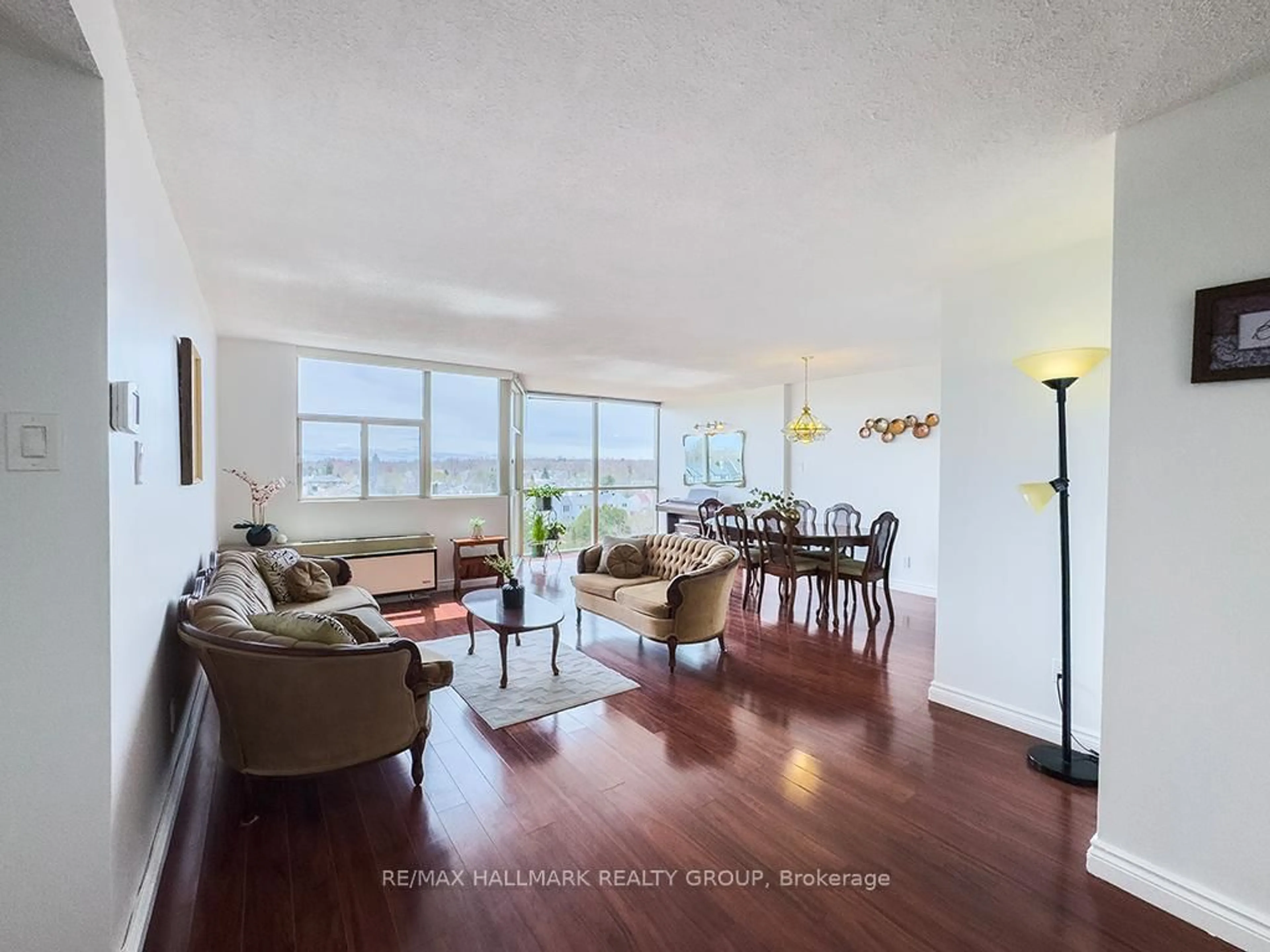 Living room with furniture, wood/laminate floor for 2760 Carousel Cres #707, Ottawa Ontario K1T 2N4
