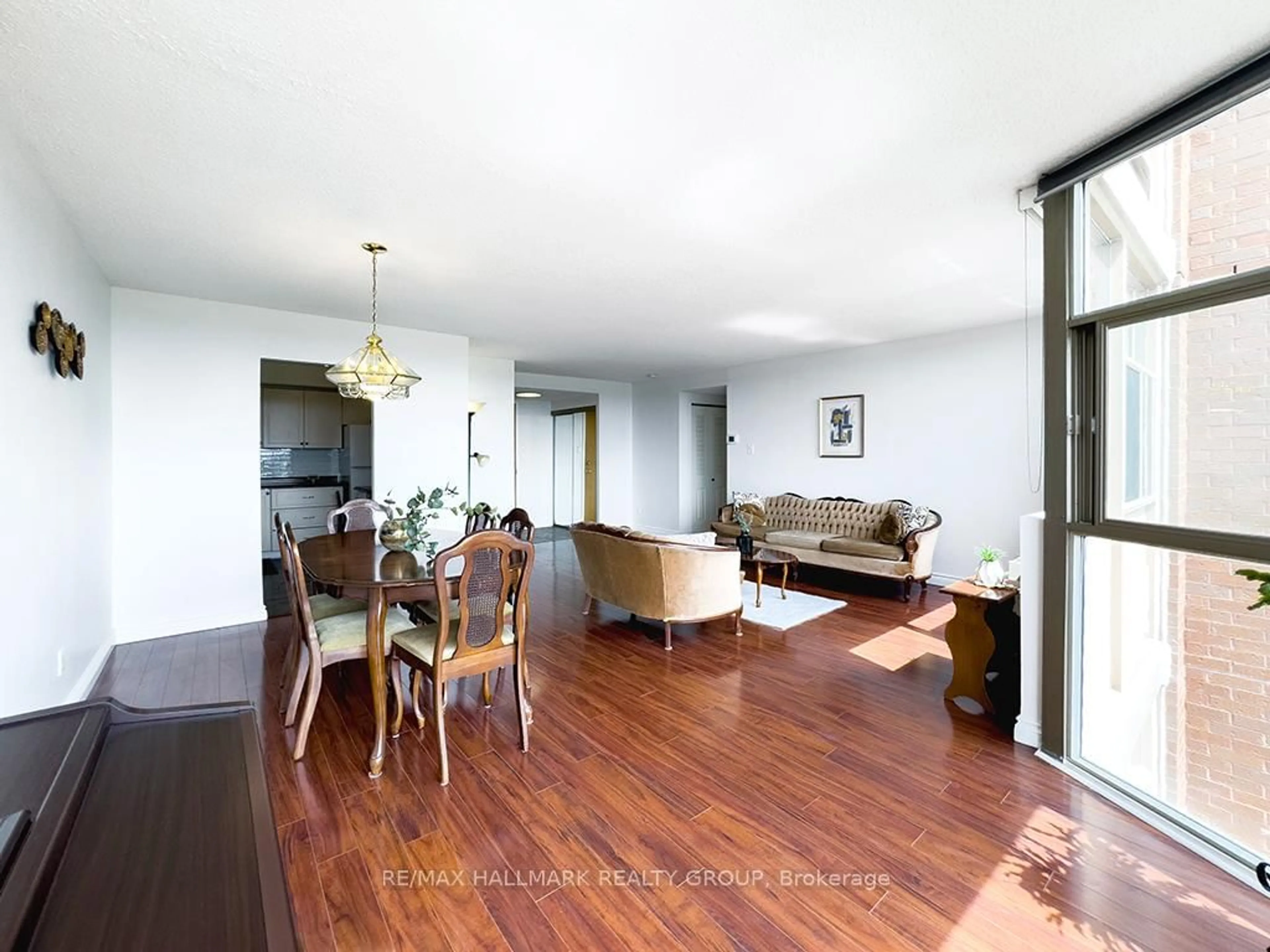 Living room with furniture, wood/laminate floor for 2760 Carousel Cres #707, Ottawa Ontario K1T 2N4
