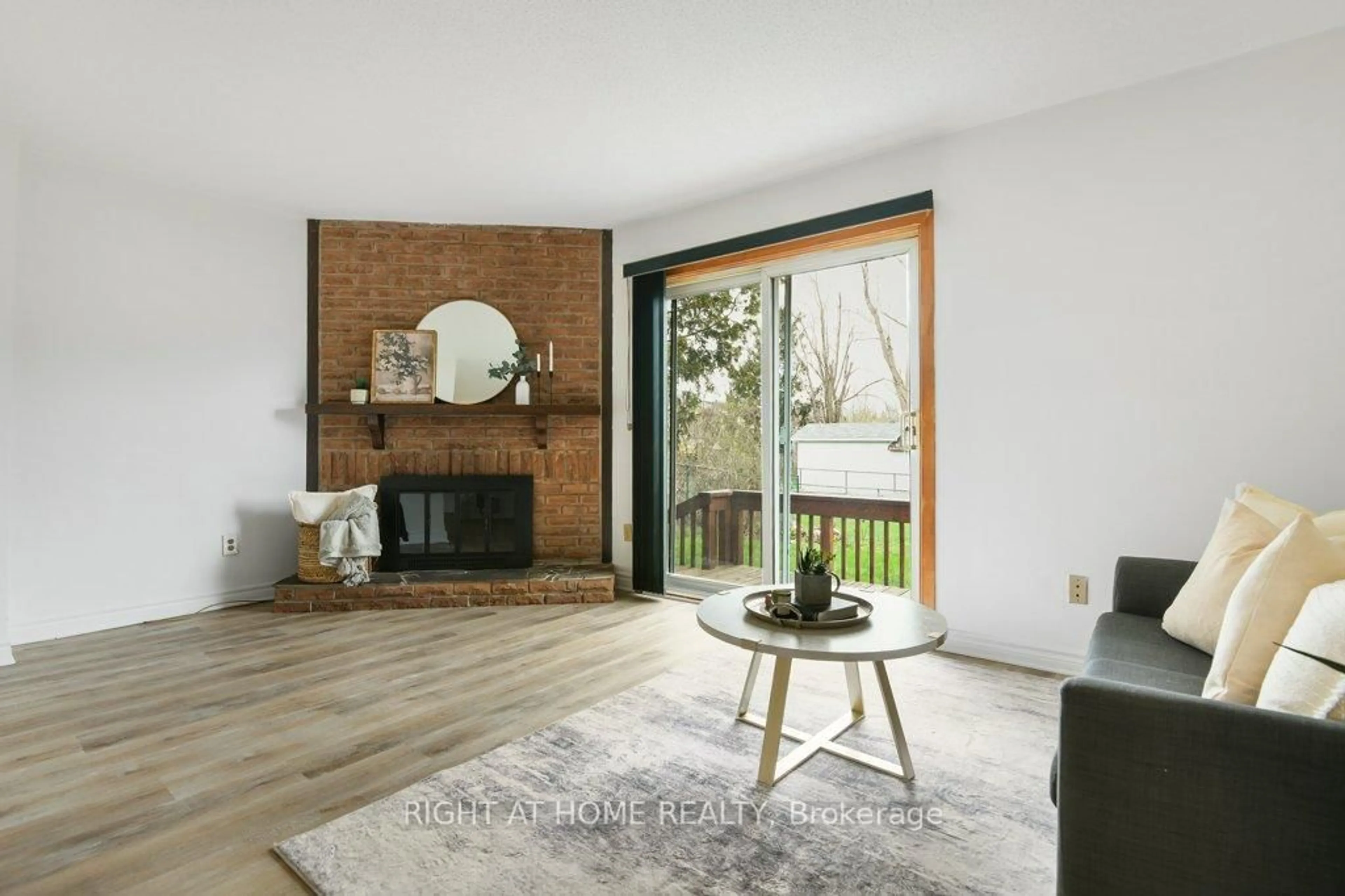 Living room with furniture, wood/laminate floor for 13 Amherst Cres, Nepean Ontario K2J 1S7