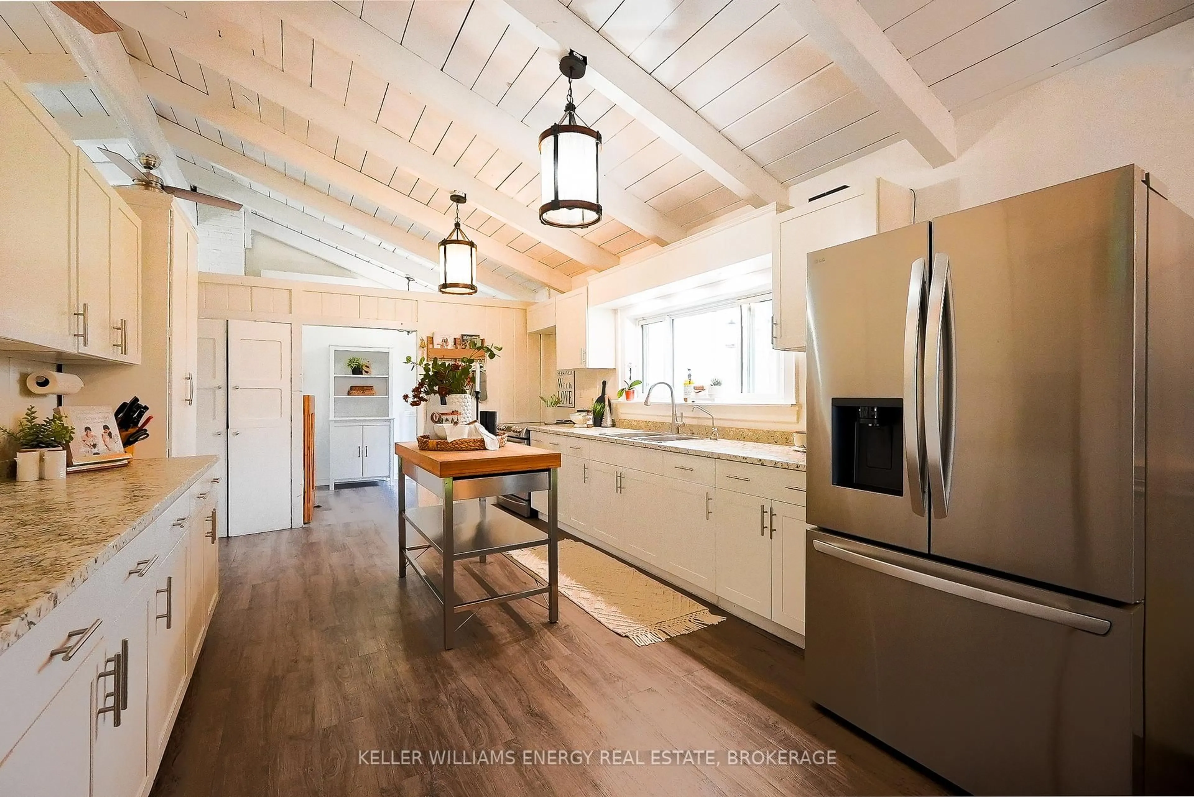 Open concept kitchen, wood/laminate floor for 54 Zion Line, Cavan Monaghan Ontario L0A 1G0