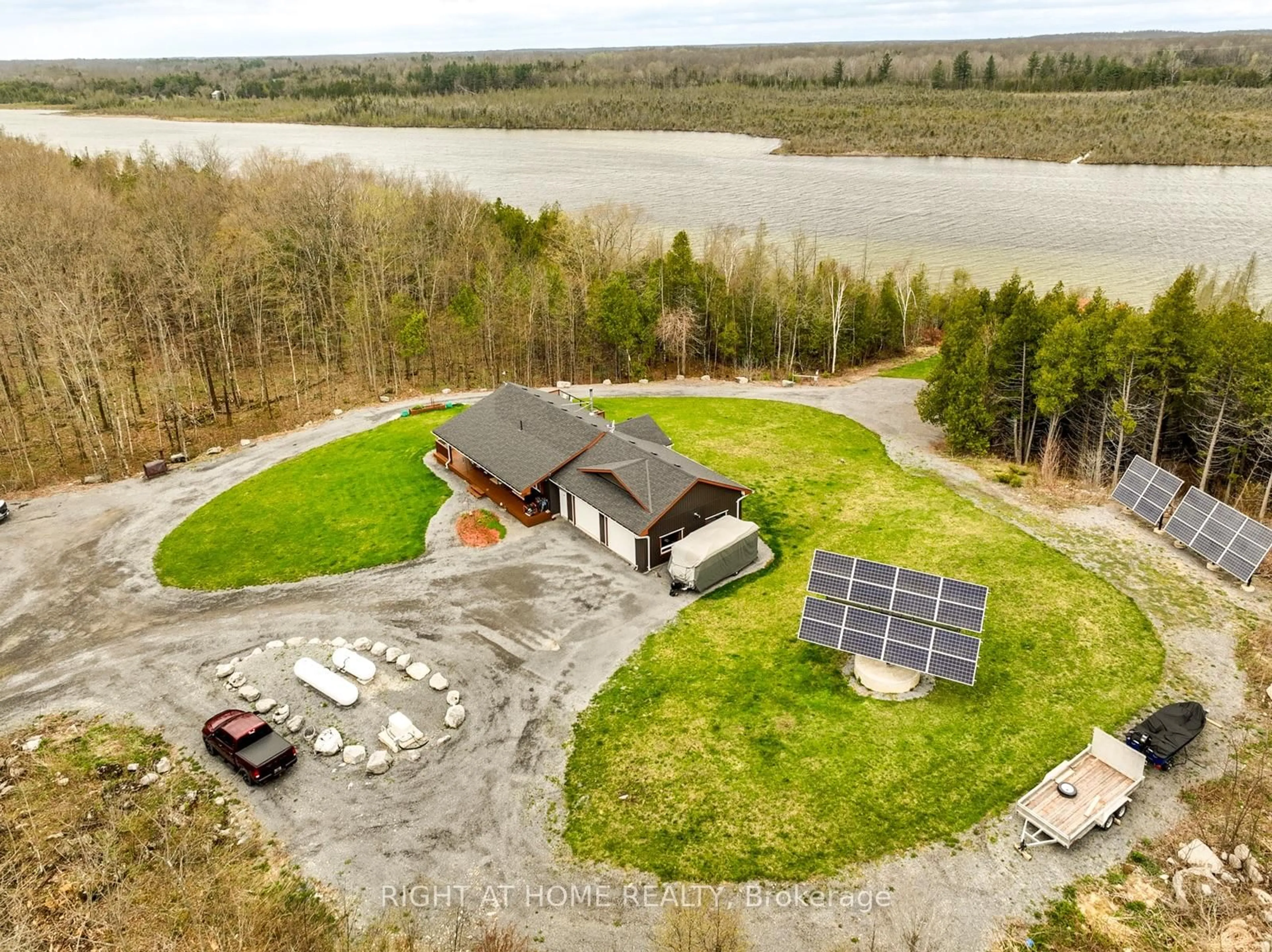 A pic from outside/outdoor area/front of a property/back of a property/a pic from drone, water/lake/river/ocean view for 452A COLDWATER Rd, Tweed Ontario K0K 2L0