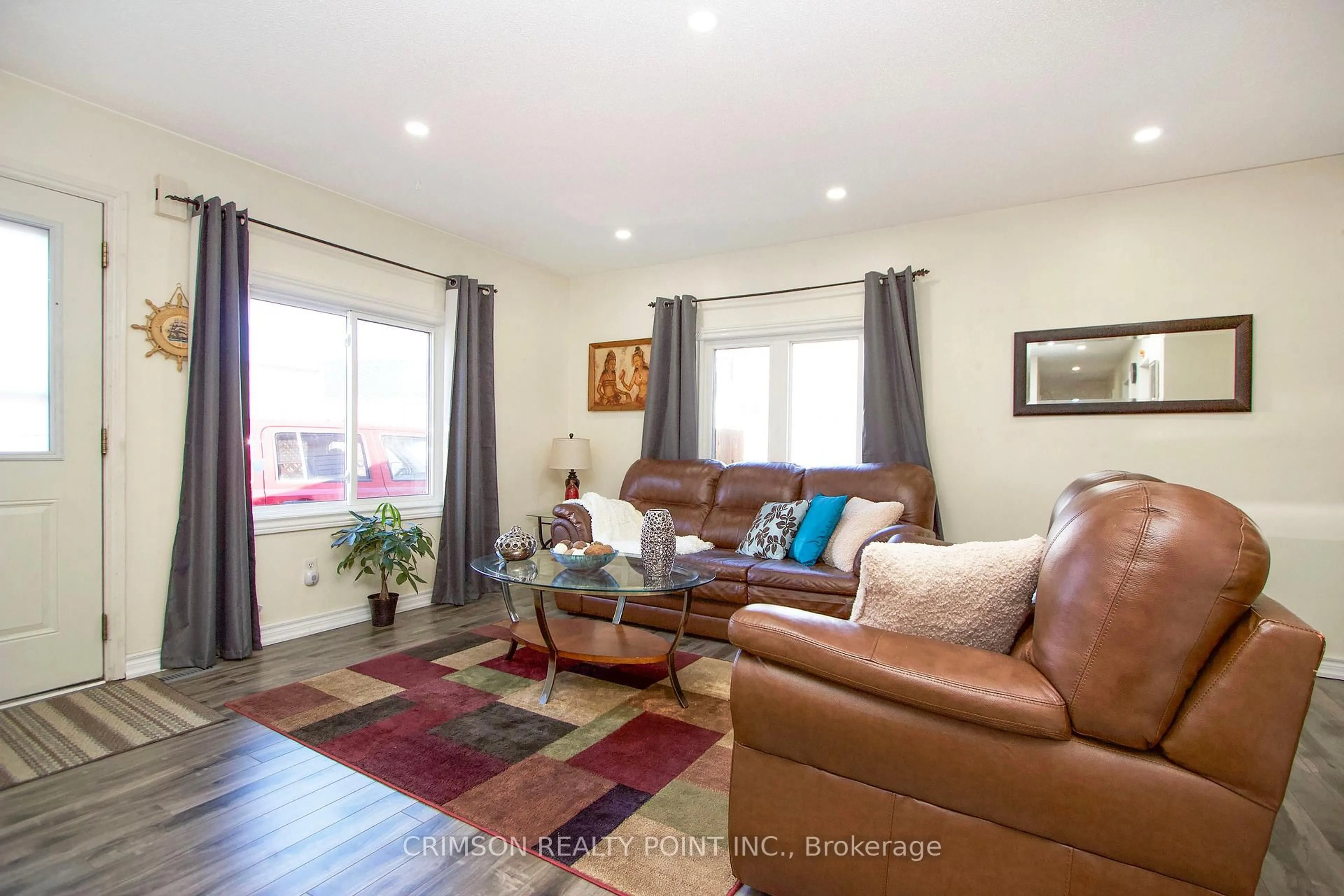 Living room with furniture, wood/laminate floor for 33 TORONTO St, Cramahe Ontario K0K 1S0