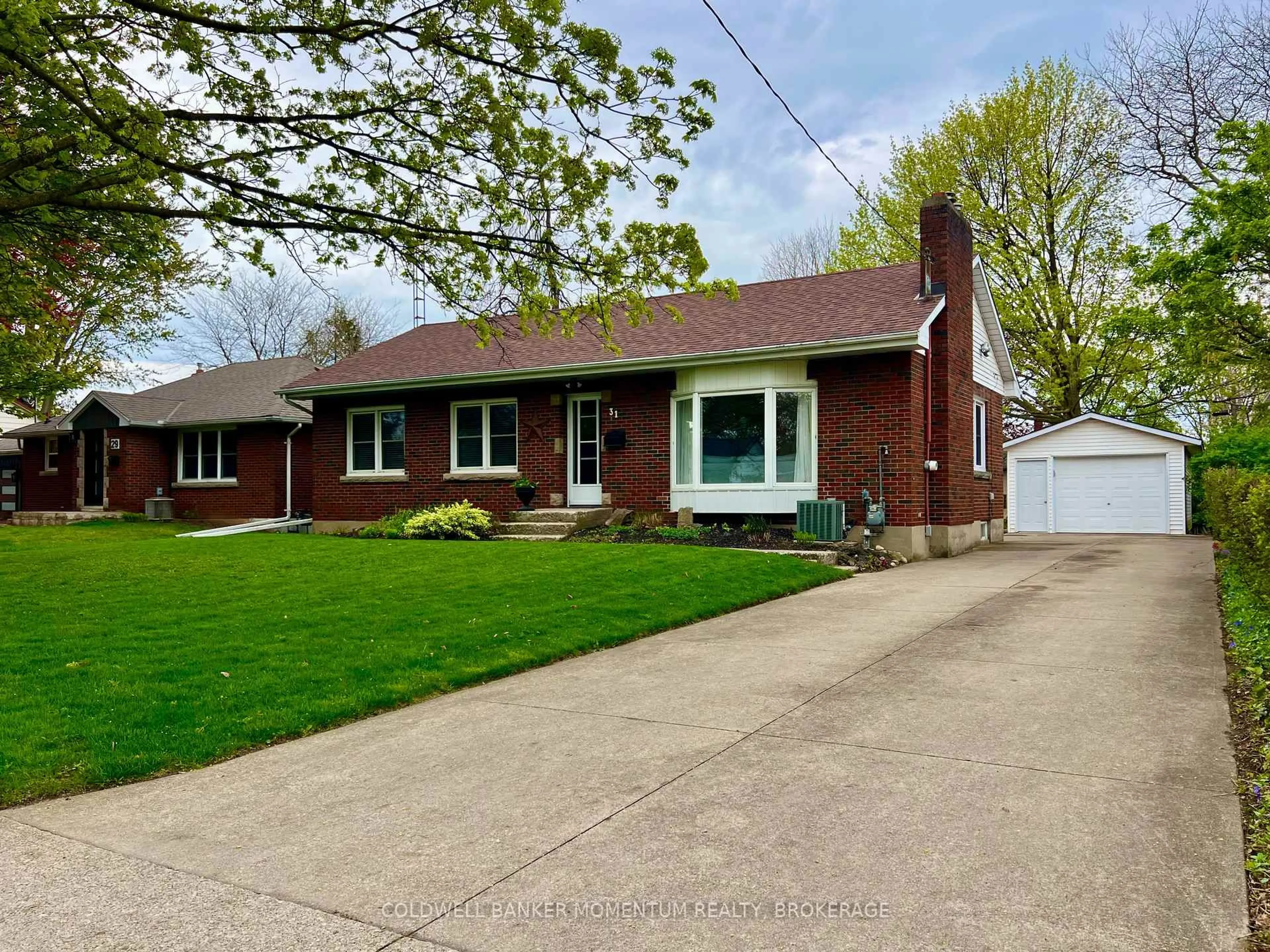 Home with brick exterior material, street for 31 Woodelm Dr, St. Catharines Ontario L2M 4N5