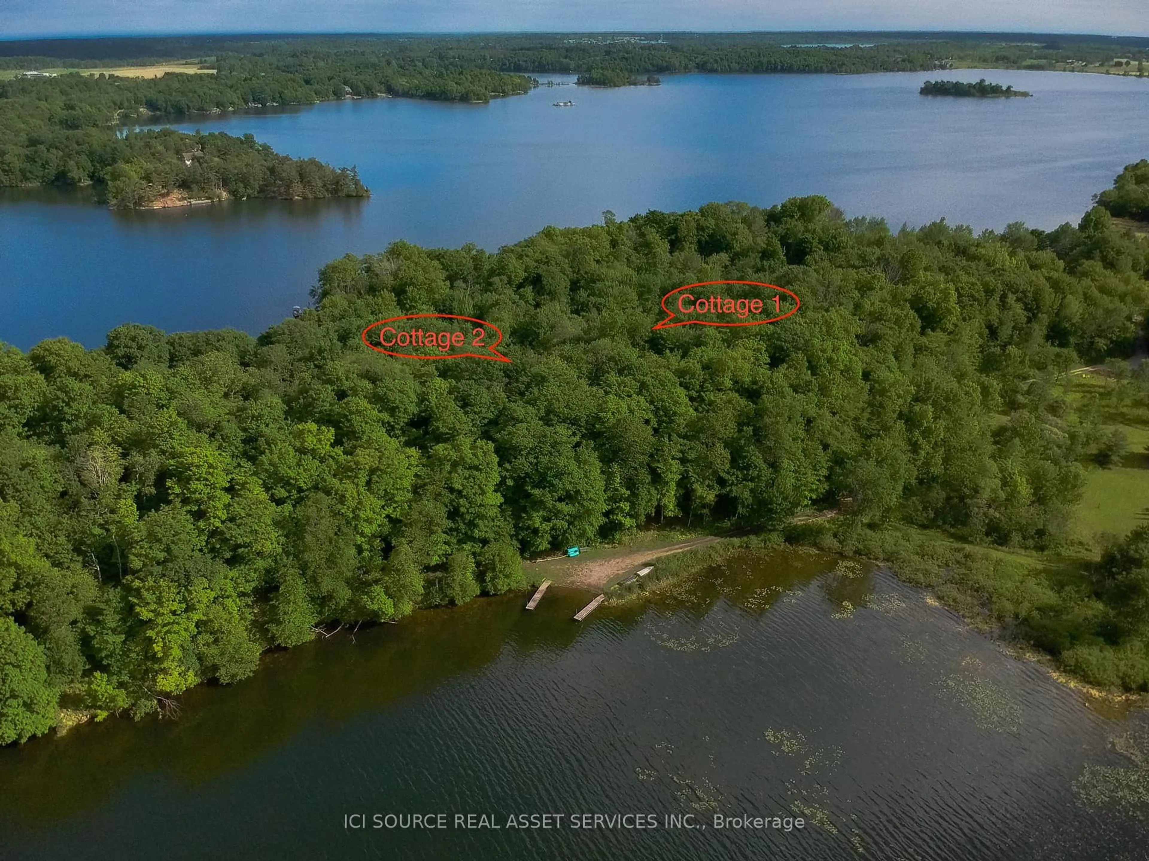 A pic from outside/outdoor area/front of a property/back of a property/a pic from drone, water/lake/river/ocean view for 4071 Hiawatha Lane, Battersea Ontario K0H 1H0