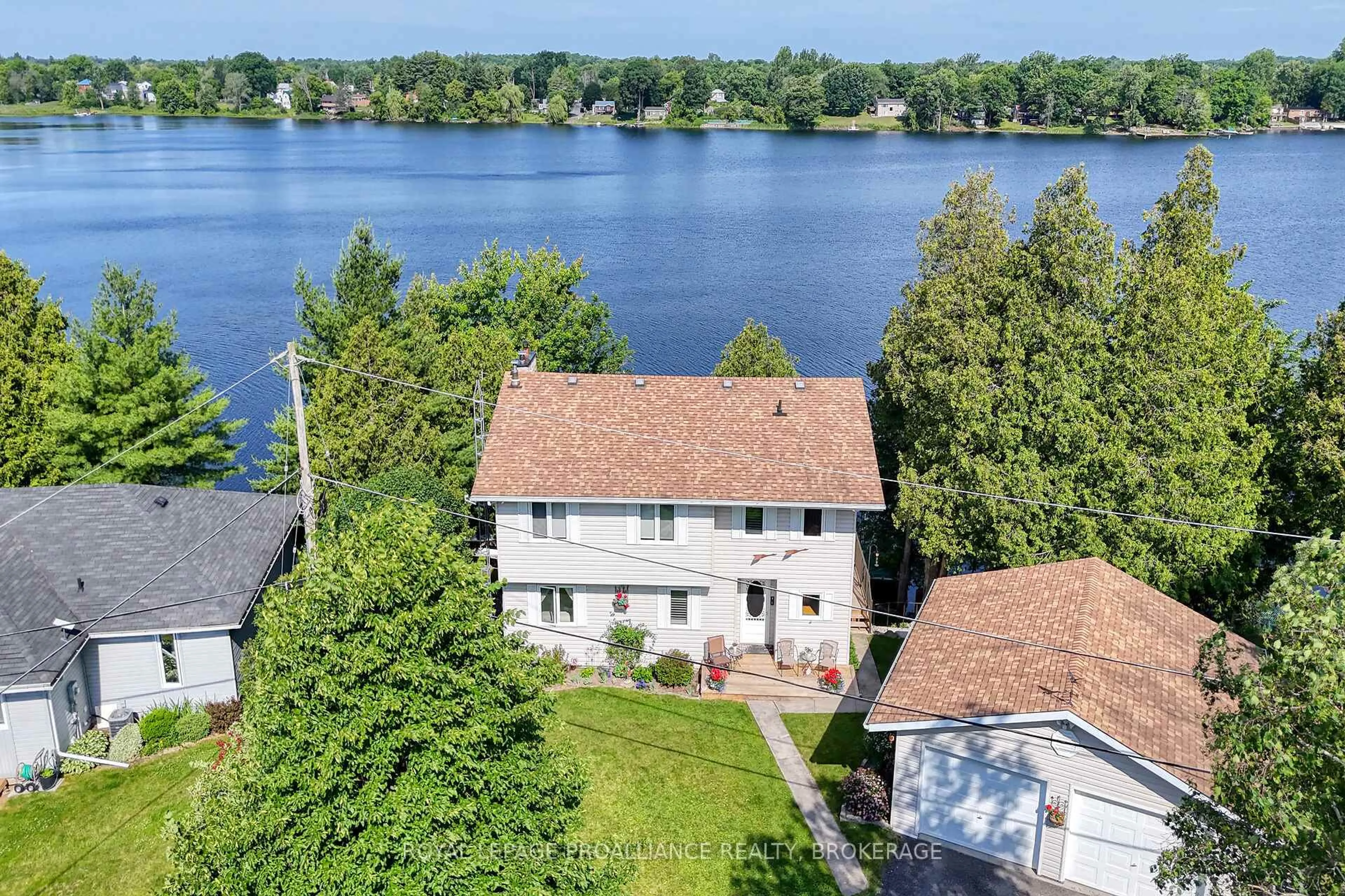 A pic from outside/outdoor area/front of a property/back of a property/a pic from drone, water/lake/river/ocean view for 1016 Rocky Shore Lane, Hartington Ontario K0H 1W0