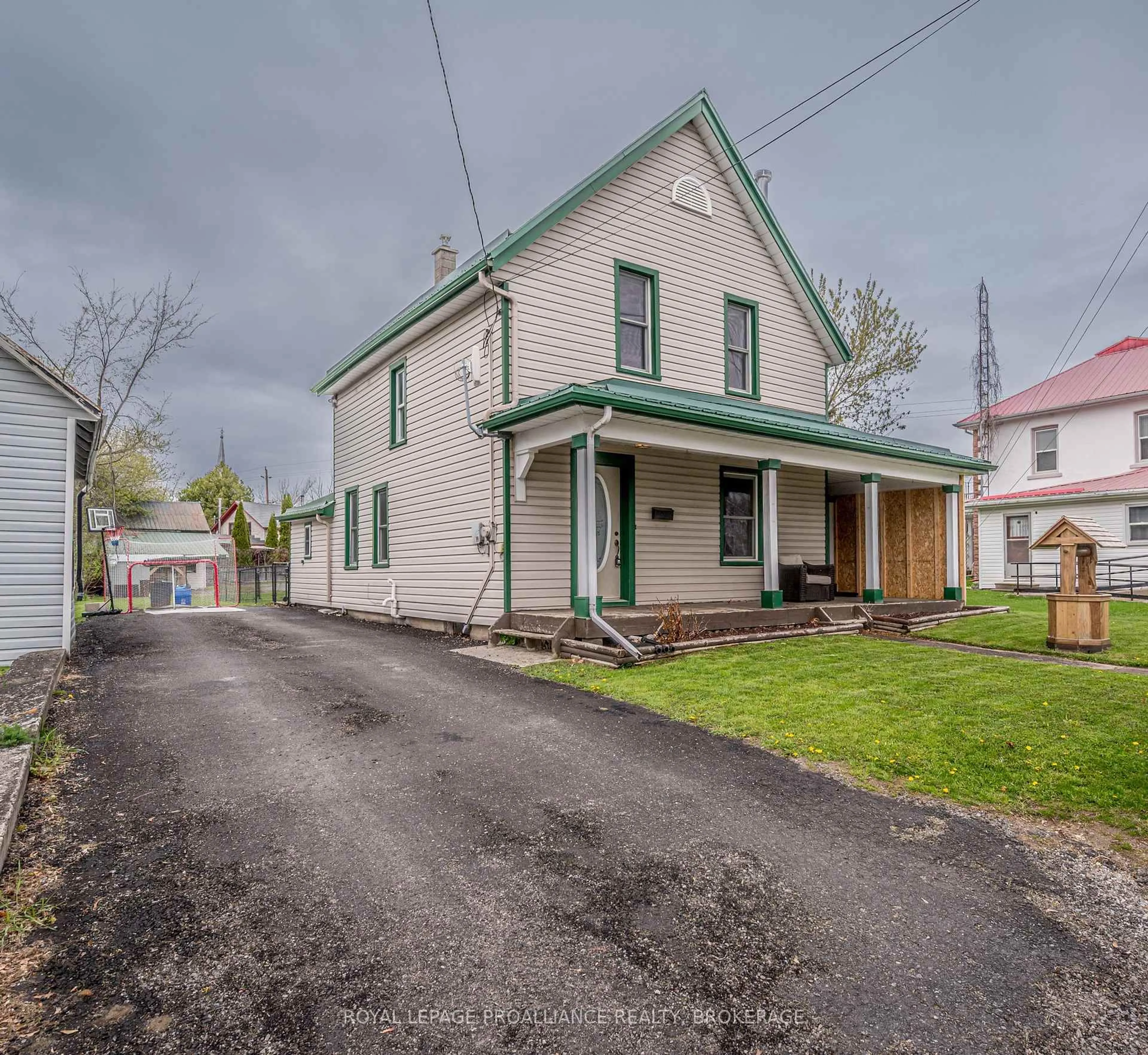 A pic from outside/outdoor area/front of a property/back of a property/a pic from drone, street for 4089 Perth Rd, Inverary Ontario K0H 1X0