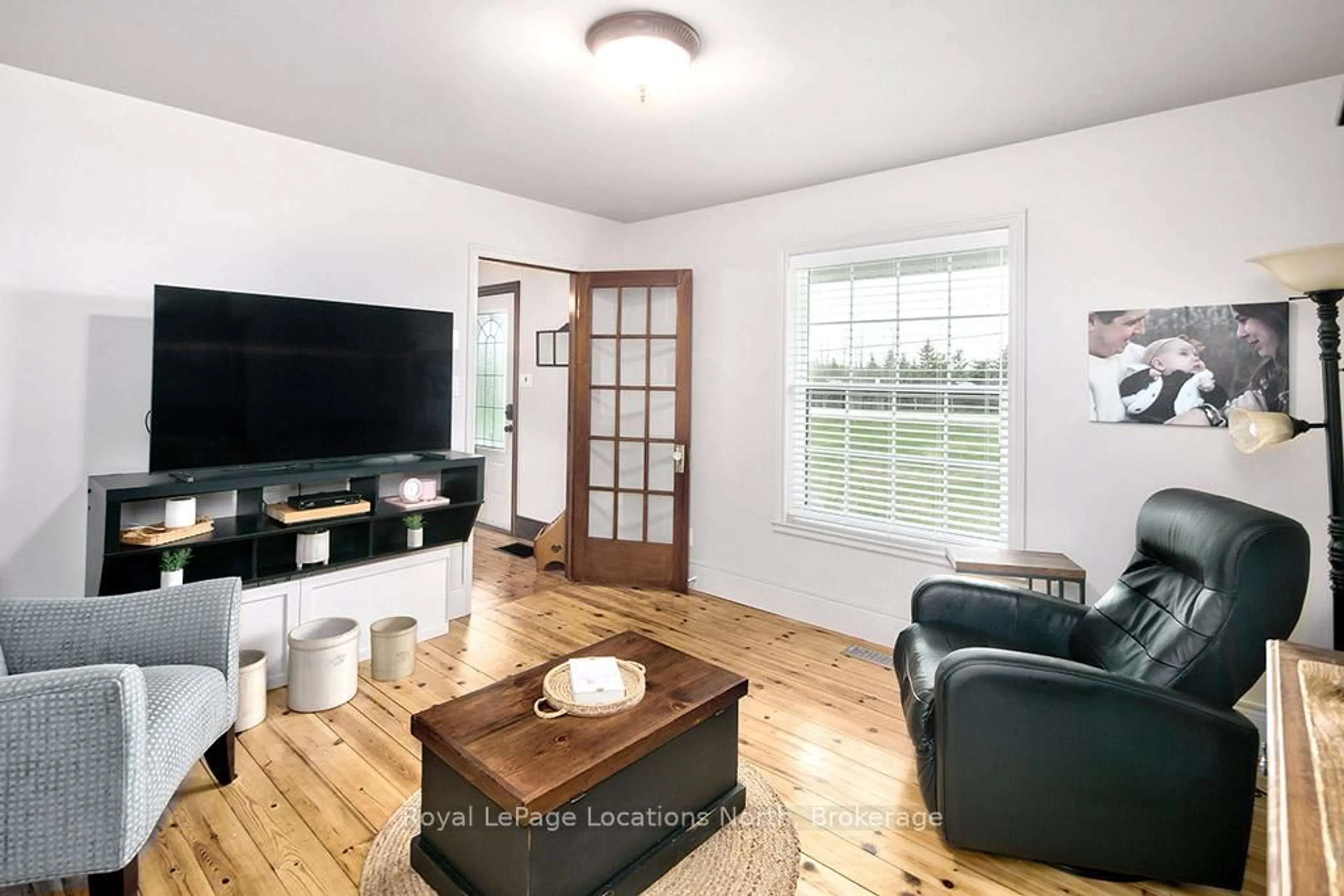 Living room with furniture, wood/laminate floor for 139049 112 Grey Rd, Meaford Ontario N4L 1W5
