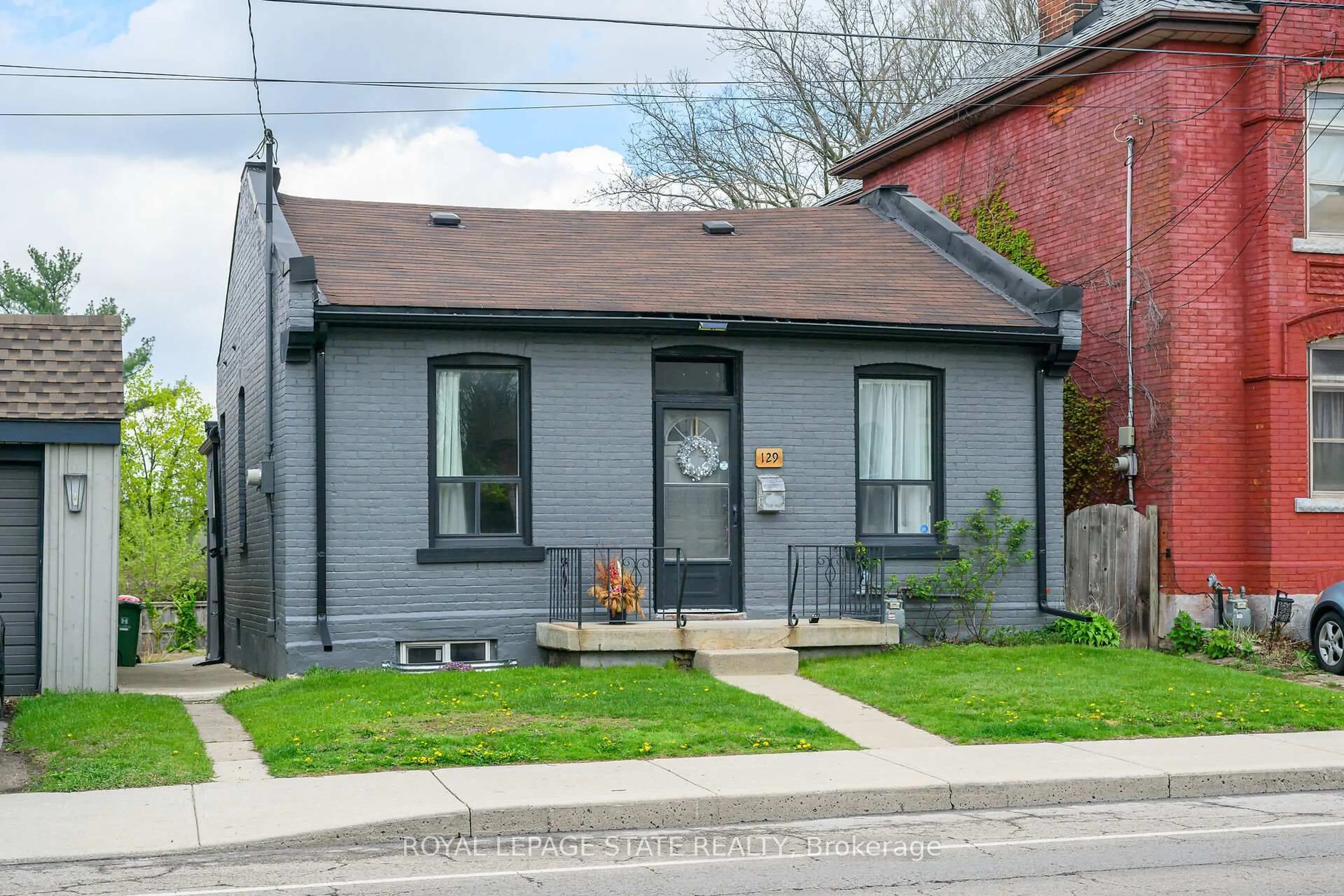 Home with brick exterior material, street for 129 Dundurn St, Hamilton Ontario L8R 3E7