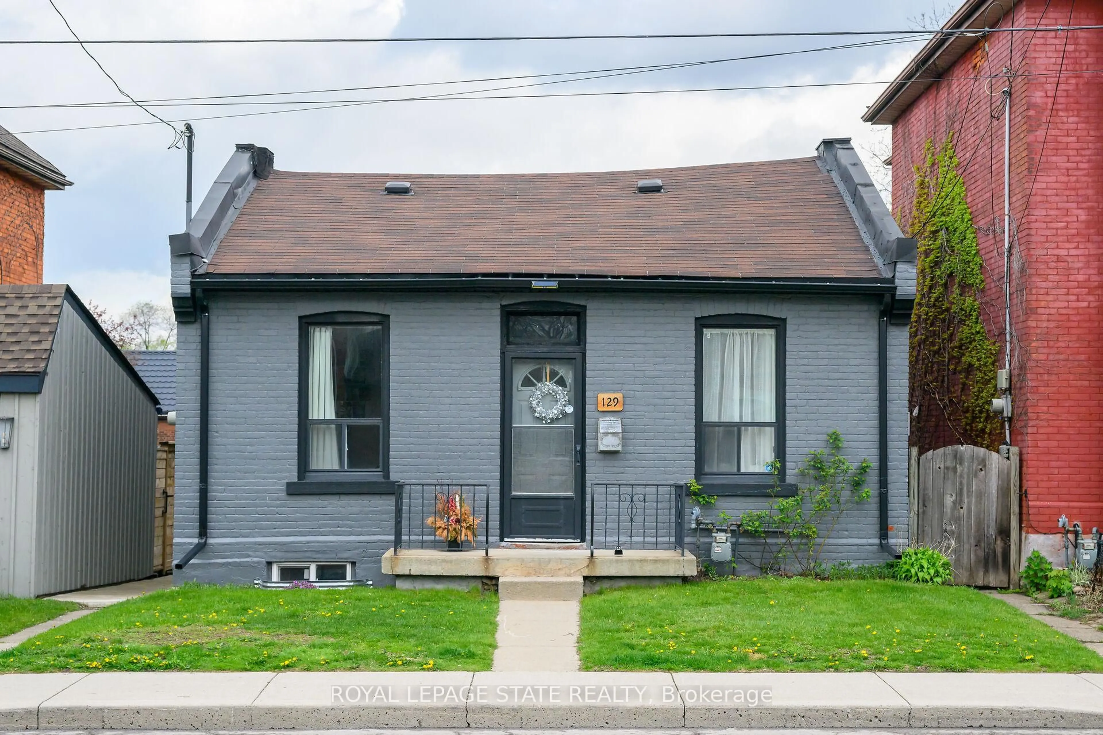 Home with brick exterior material, street for 129 Dundurn St, Hamilton Ontario L8R 3E7
