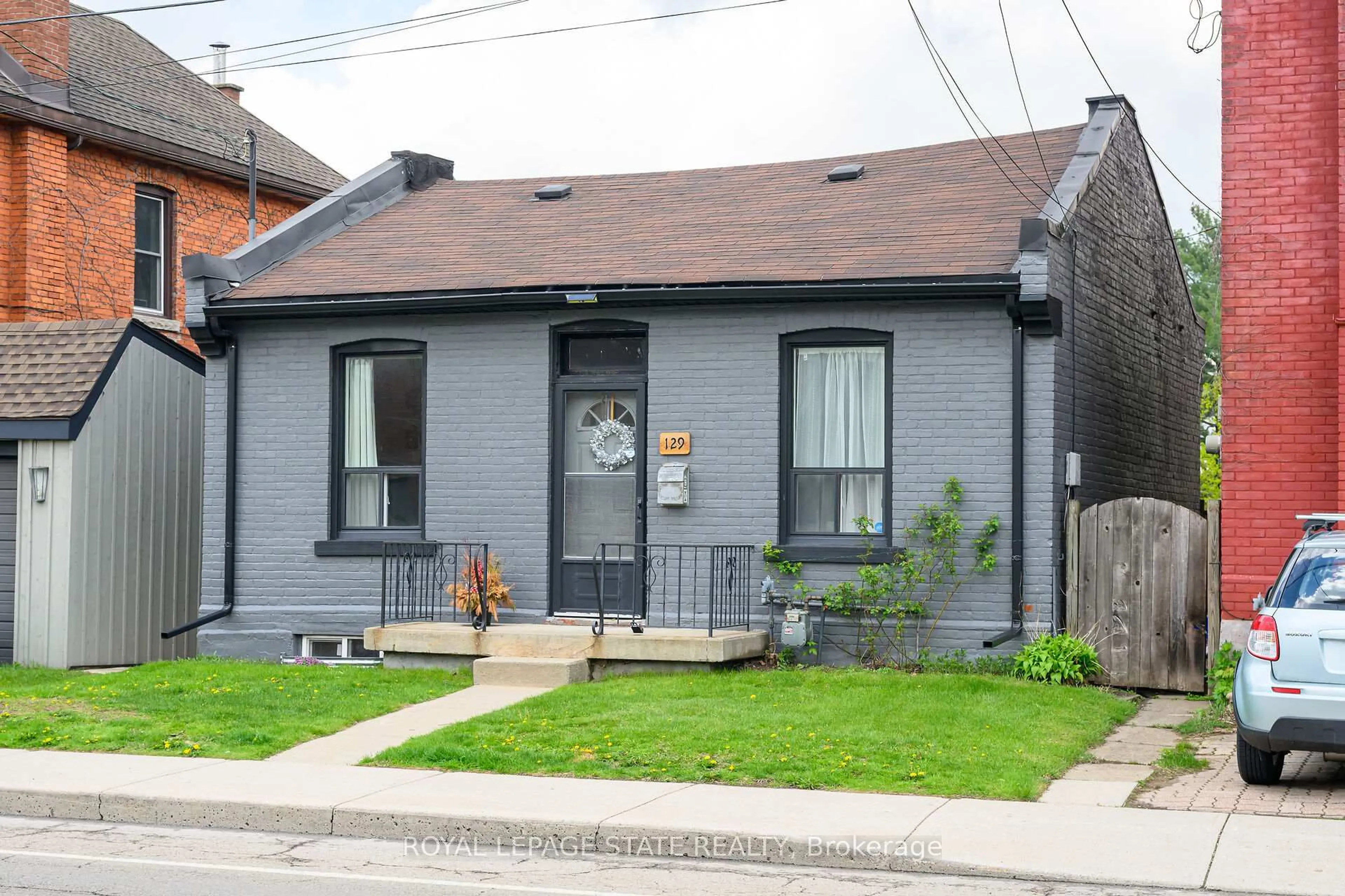 Home with brick exterior material, street for 129 Dundurn St, Hamilton Ontario L8R 3E7