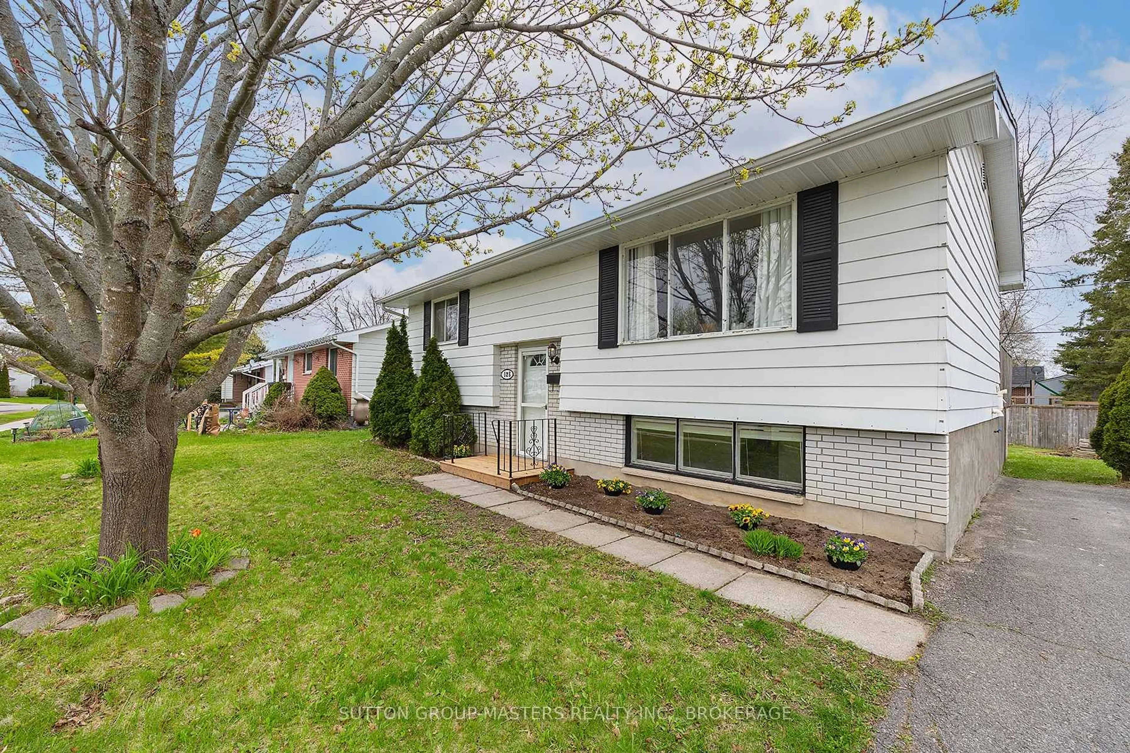 Home with vinyl exterior material, street for 128 Sherwood Ave, Loyalist Ontario K7N 1N8