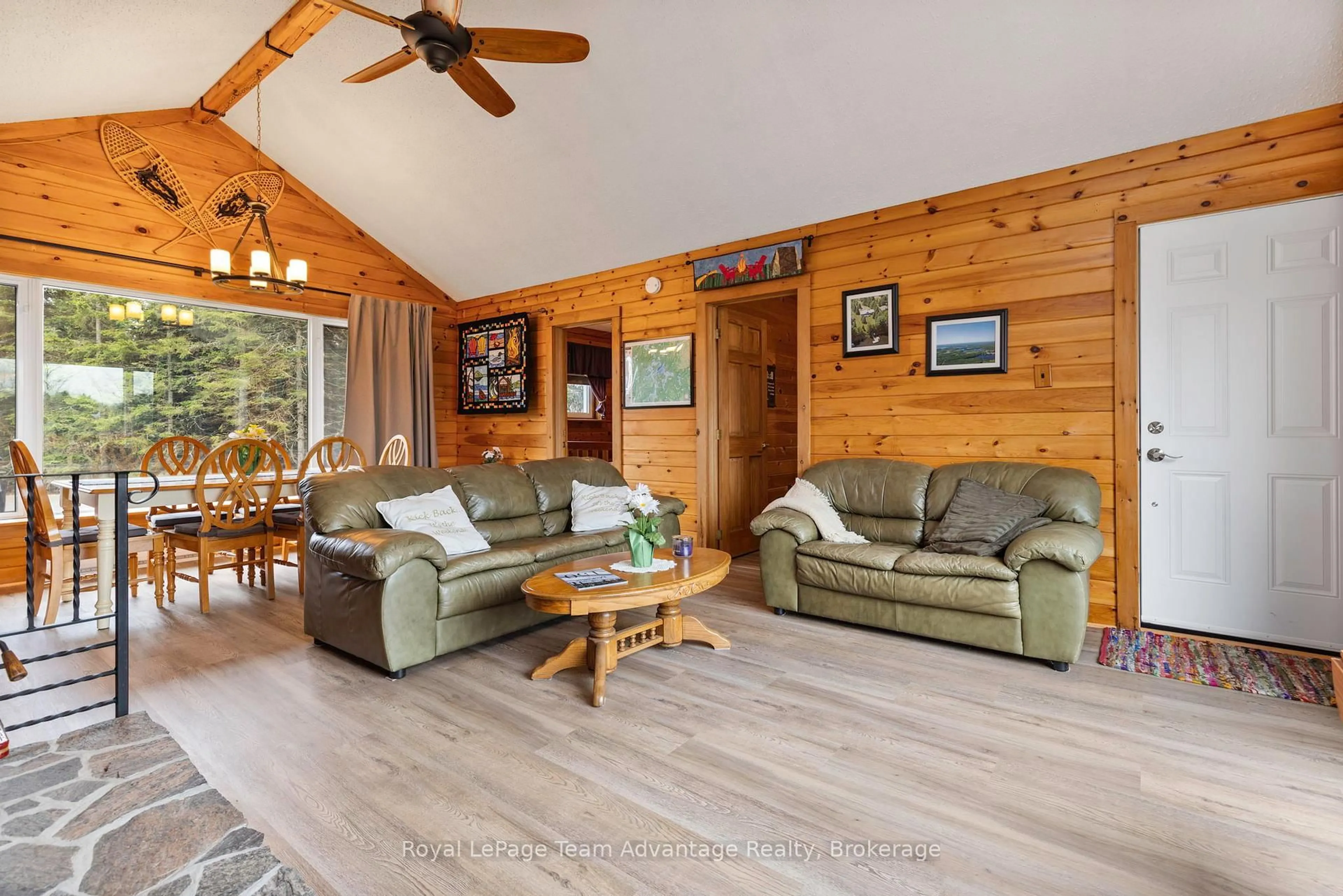 Living room with furniture, wood/laminate floor for 88 Stoney Rd, McKellar Ontario P0G 1C0