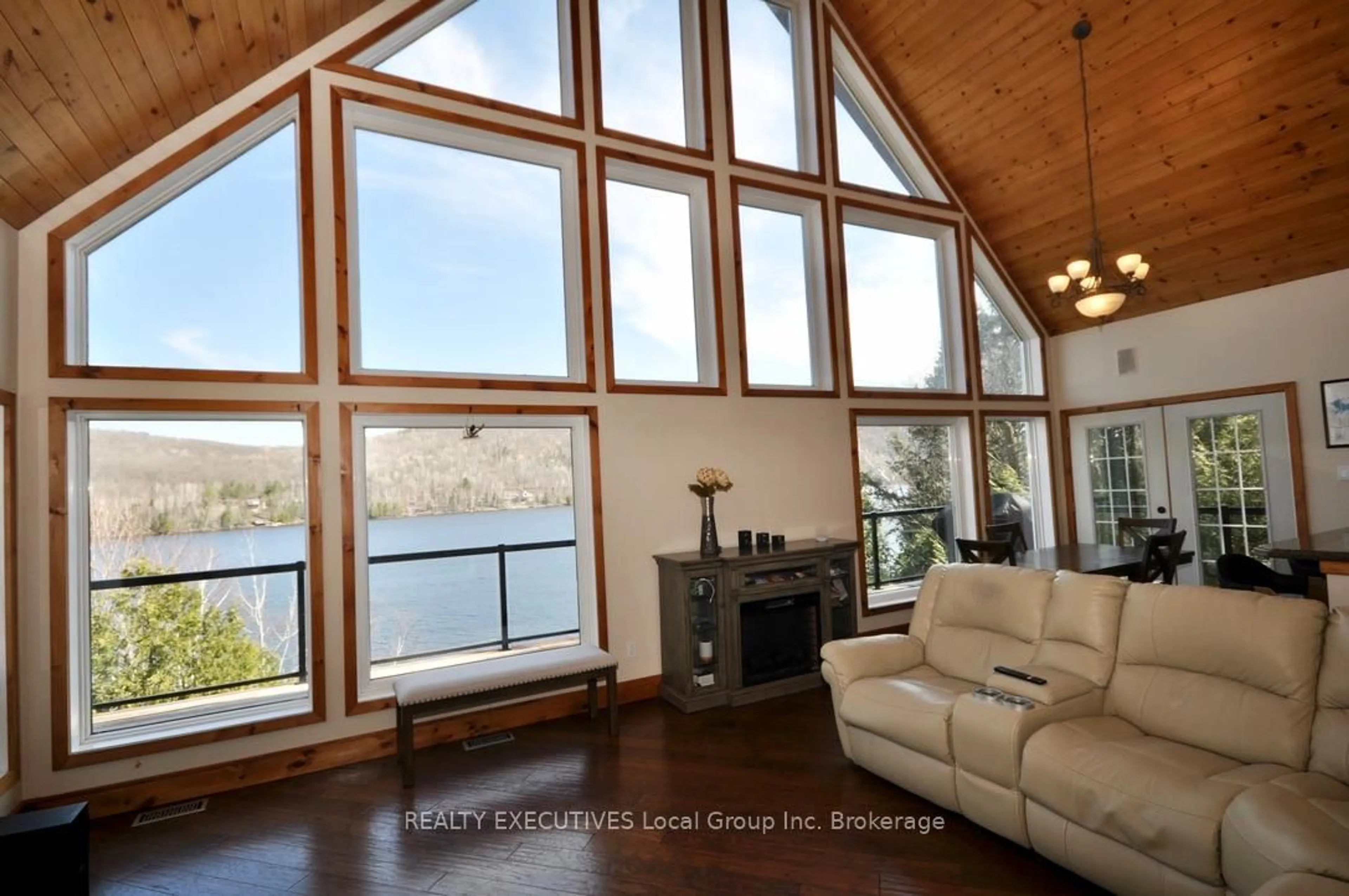 Living room with furniture, wood/laminate floor for 400C Shorewood Rd, North Bay Ontario P1B 8G4