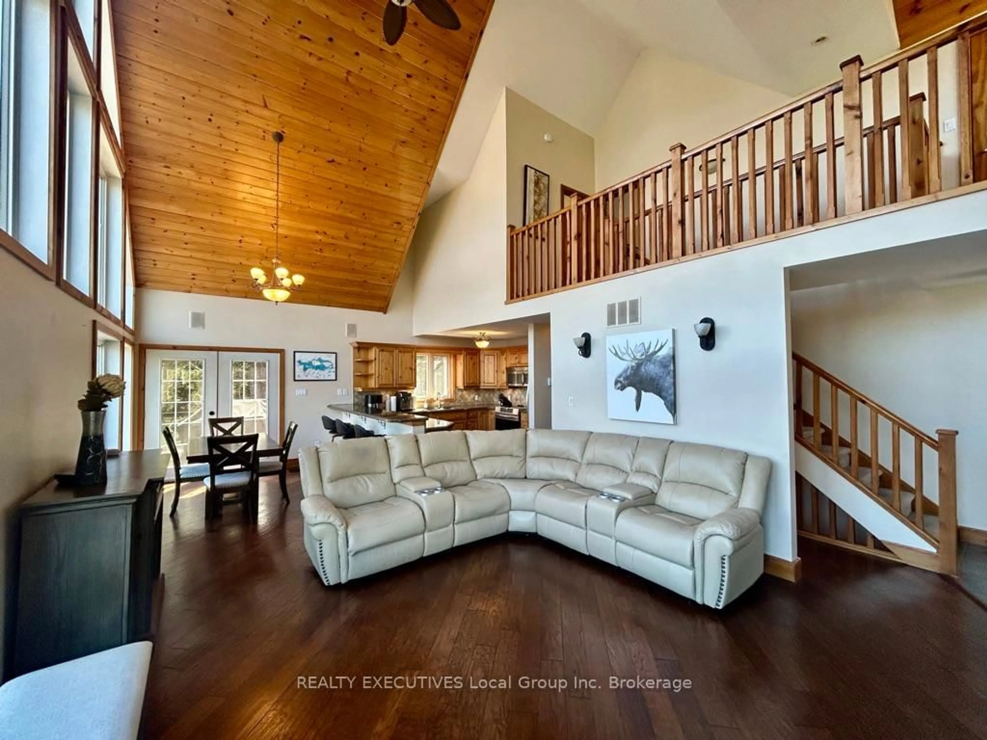 Living room with furniture, wood/laminate floor for 400C Shorewood Rd, North Bay Ontario P1B 8G4