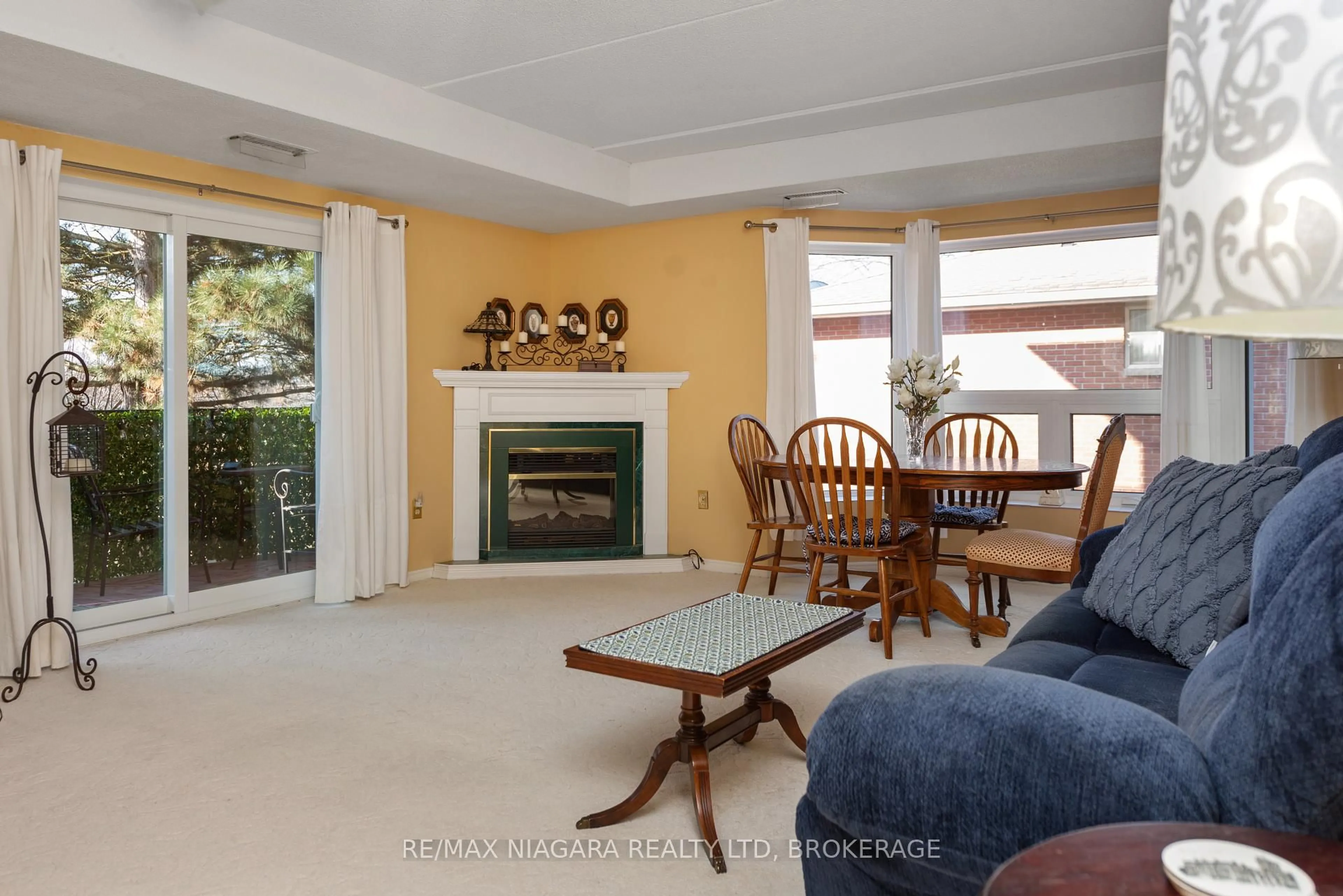 Living room with furniture, ceramic/tile floor for 6704 Thorold Stone Rd #206, Niagara Falls Ontario L2J 1B3