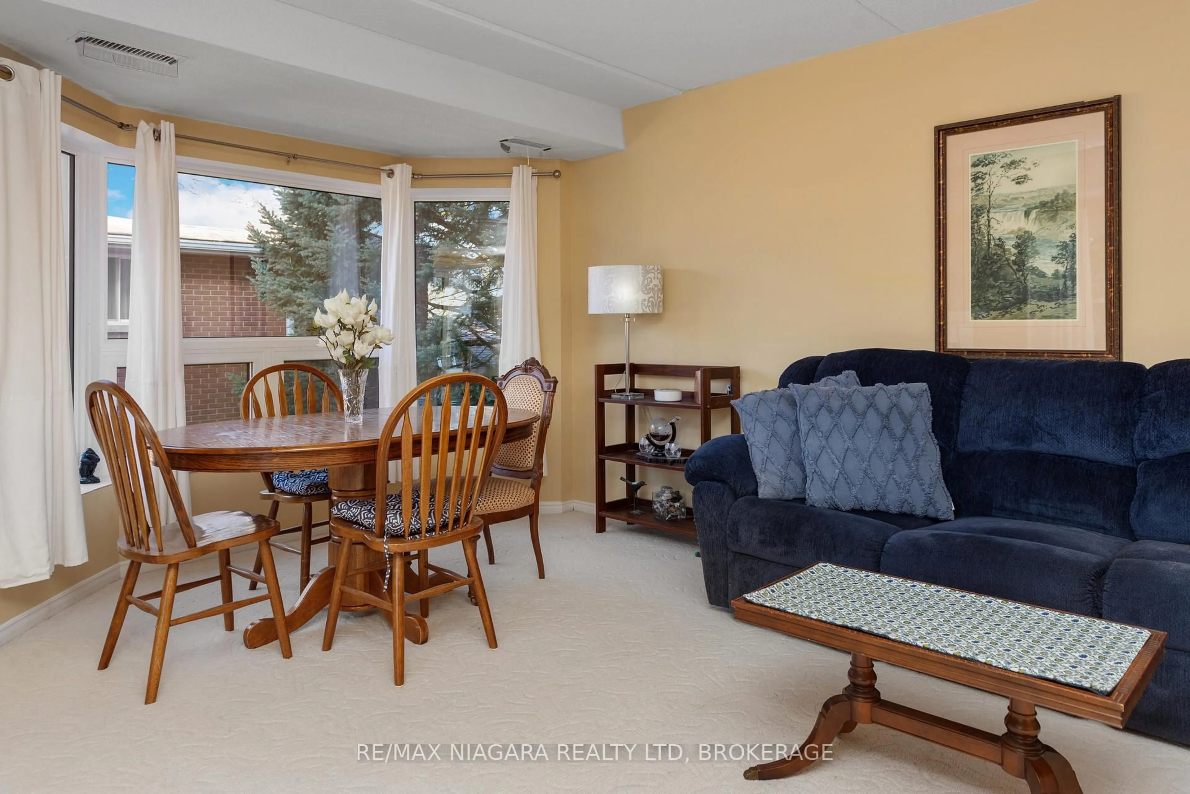 Living room with furniture, unknown for 6704 Thorold Stone Rd #206, Niagara Falls Ontario L2J 1B3