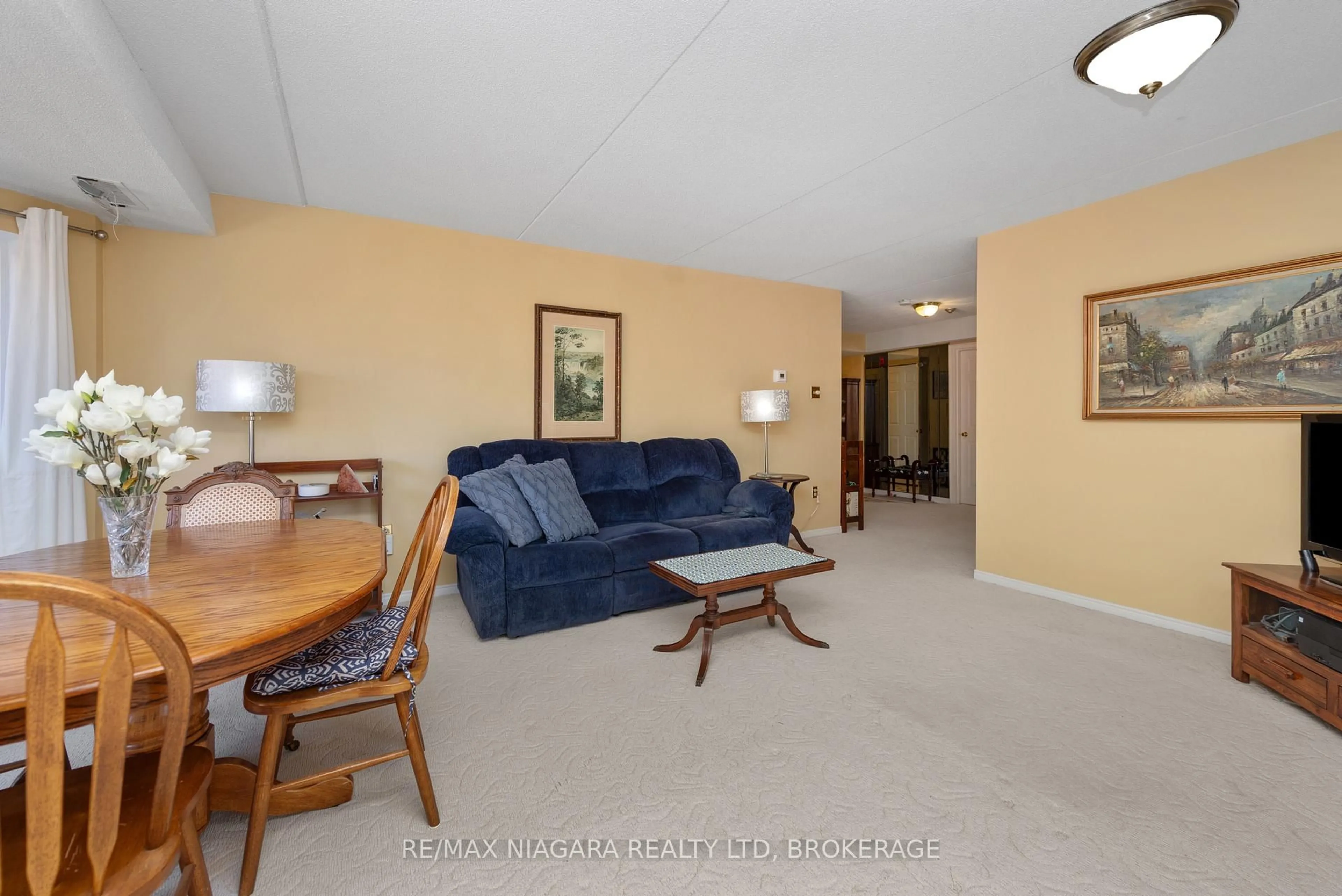 Living room with furniture, unknown for 6704 Thorold Stone Rd #206, Niagara Falls Ontario L2J 1B3
