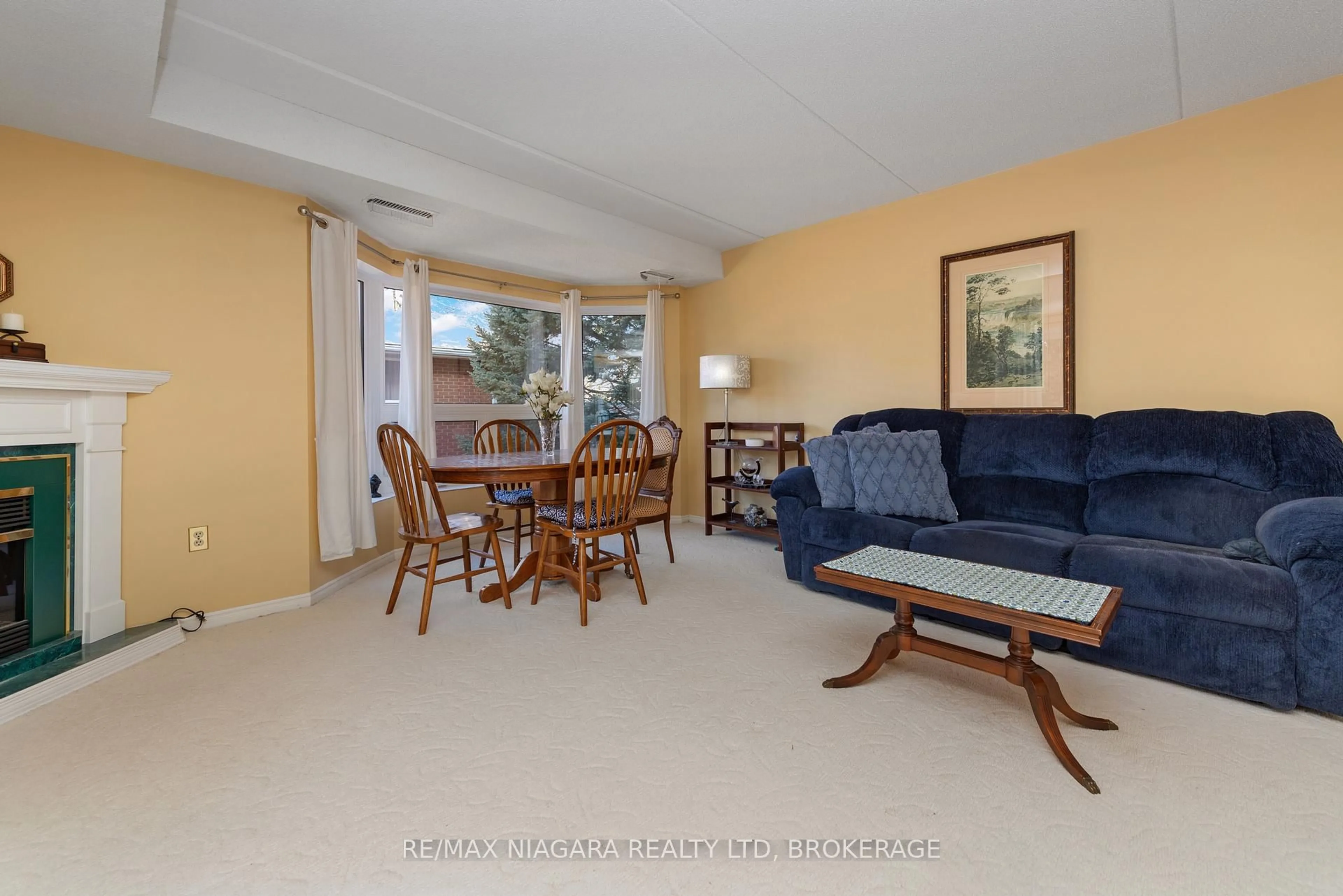 Living room with furniture, unknown for 6704 Thorold Stone Rd #206, Niagara Falls Ontario L2J 1B3