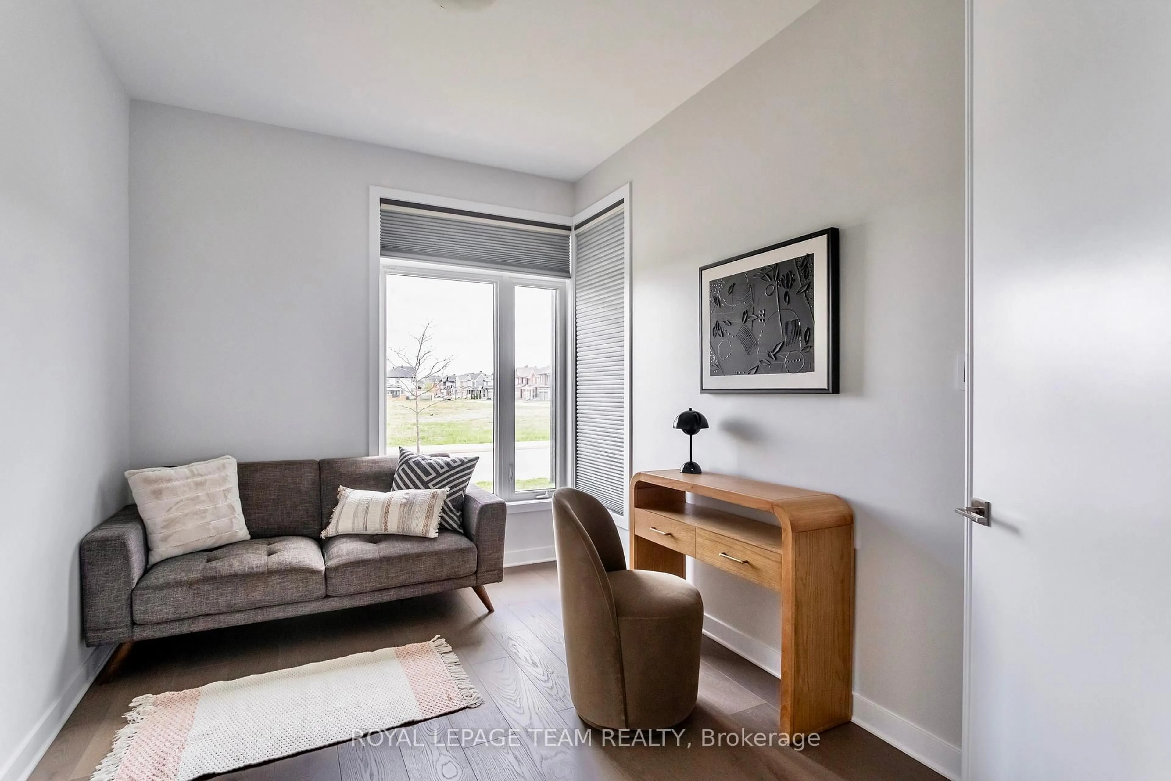 Living room with furniture, wood/laminate floor for 611 Triangle St, Stittsville Ontario K2V 0L8